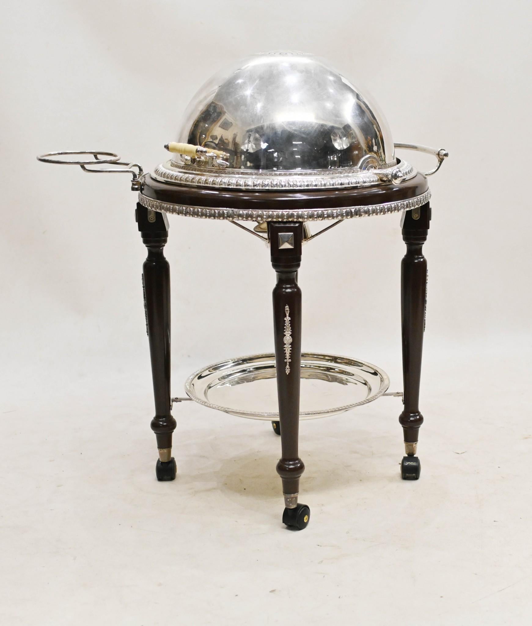 Gorgeous English silver plate and mahogany beef trolley
Classic high end restaurant or carvery piece
Circa 1950s
Portable revolving silver plate food trolley complete with plate rack and burners
Fully restored to formed glory
Piece is on castors and