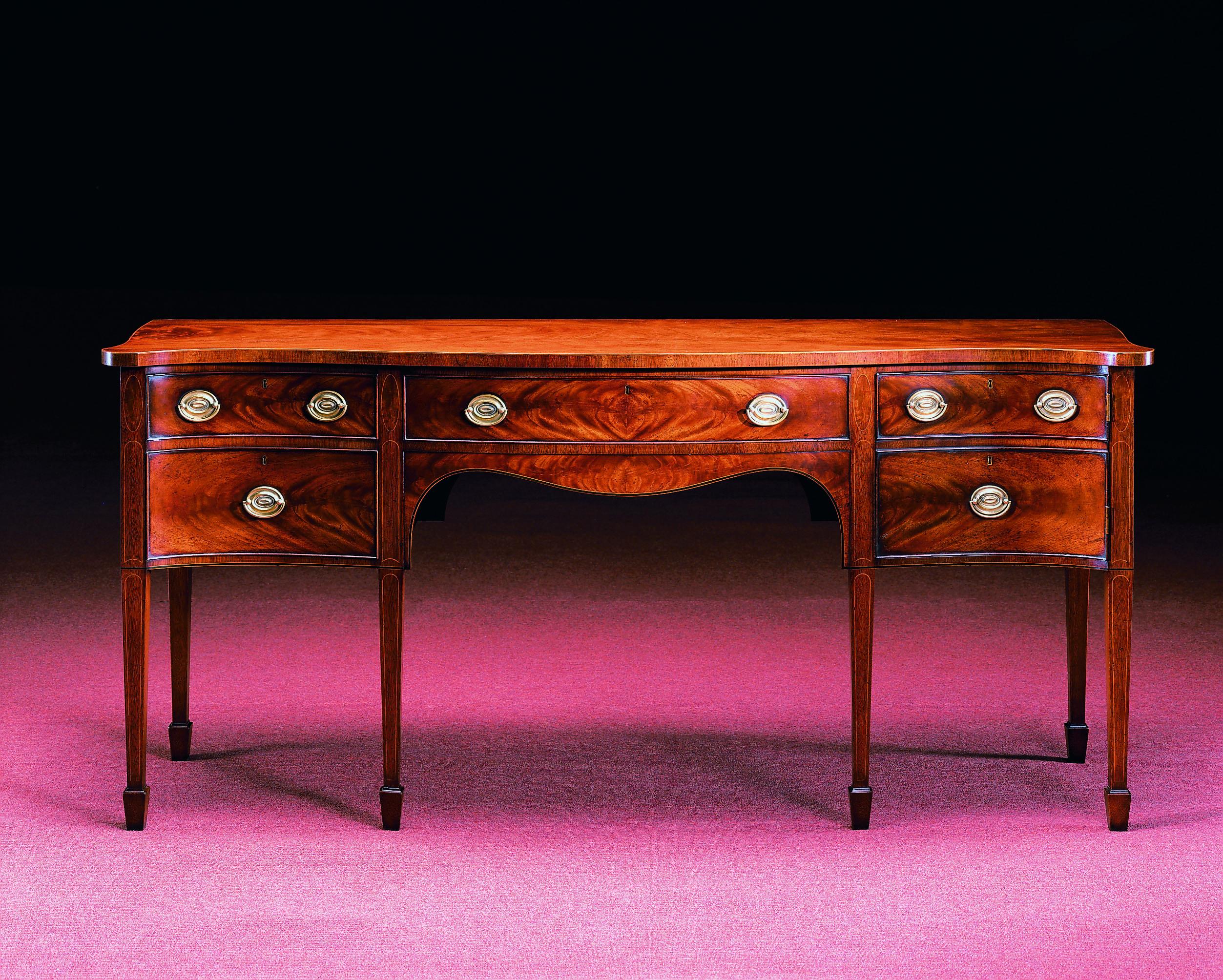 Again, it's the regal silent type that makes a strong quality statement!

This New English bench-made Mahogany sideboard, b Wood & Hogan is inspired by a rare original of the circa 1790 Sheraton period and is a superb example of outstanding