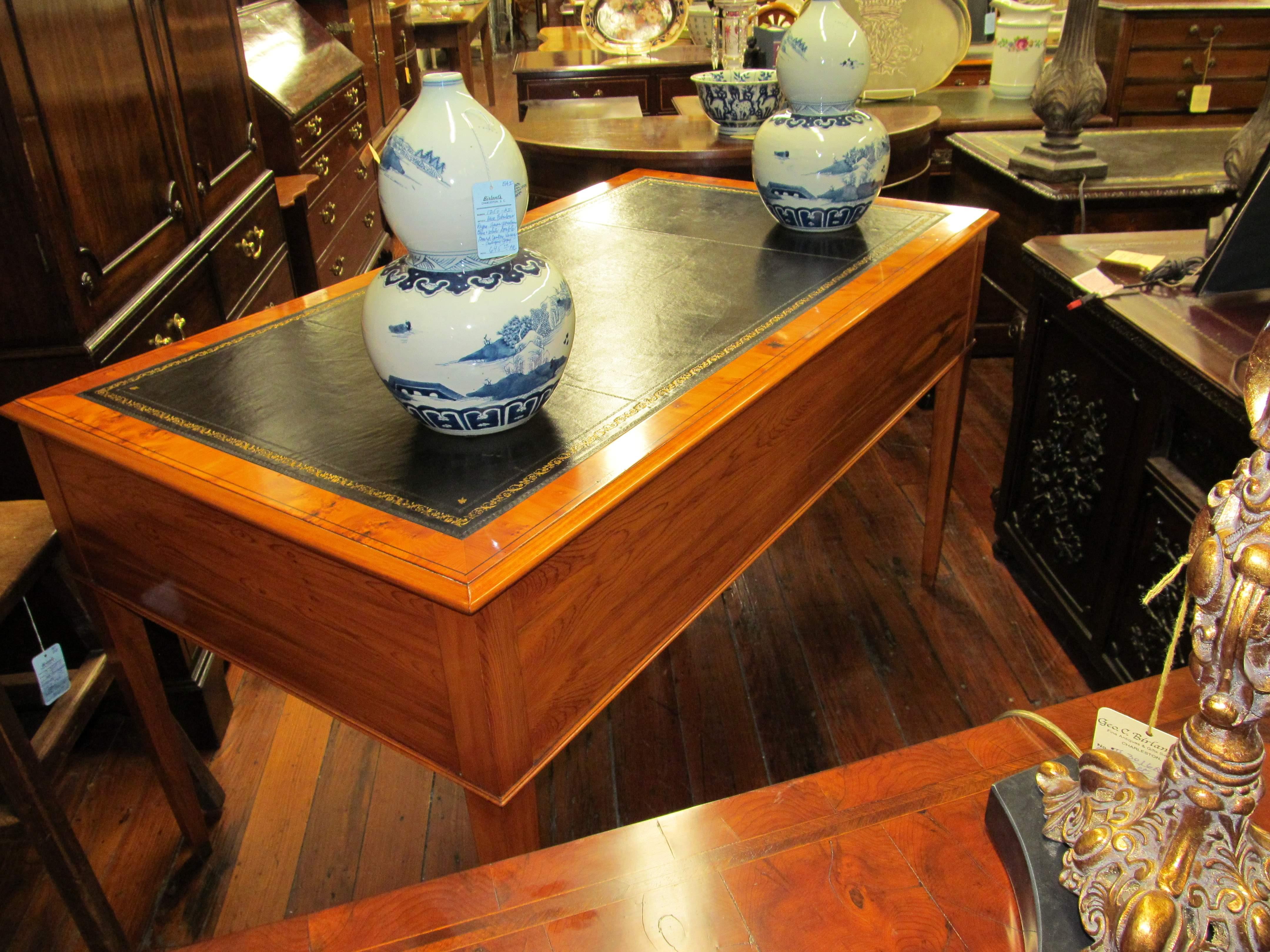 Fabulous quality English bench made pippy yew-wood leather top writing table.
Please note highly 