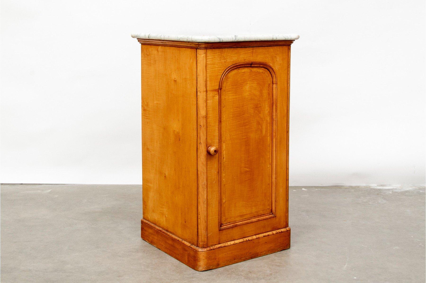 A handsome birch cabinet with a marble top that would make a perfect night table, made by Marsh & Jones and has the original label. The cabinet has a single door and 2 interior shelves. This cabinet was most likely made in the late 18th or early