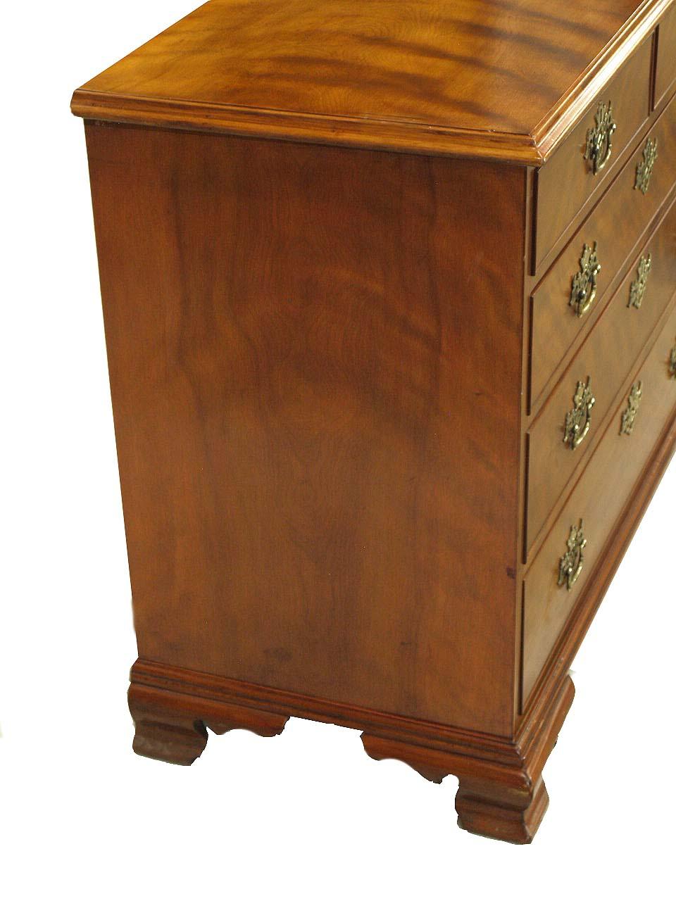English birch two over three drawer chest,  besides the useful scale of this chest, the most notable feature is the beautiful figuring of the birch grain on the drawers and top.  The graduated drawers have reticulated brass pulls and escutcheons,