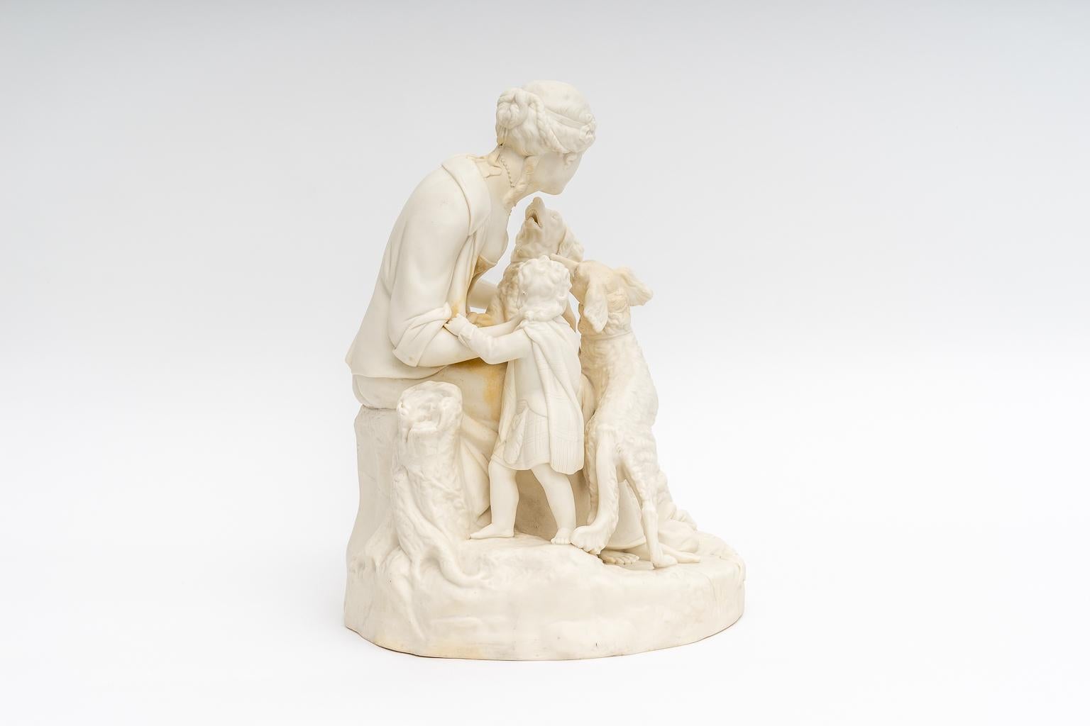 This fine figural composition features a maiden and child, together with their hunting dogs.