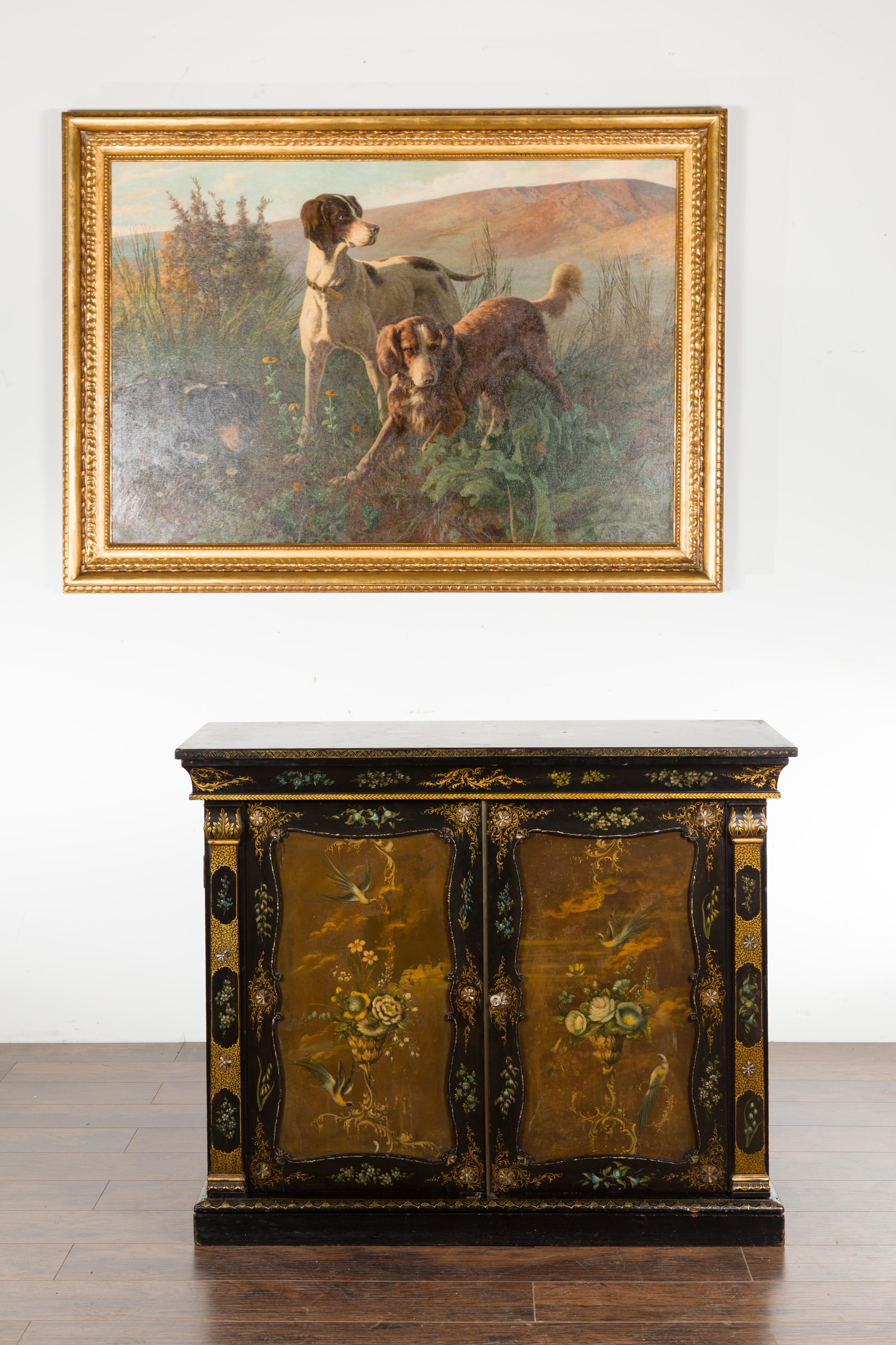 An English black and gold cabinet from the 19th century, with painted floral marble top. Created in England during the 19th century, this exquisite cabinet features a rectangular black marble top painted with a delicate decor depicting flowers and