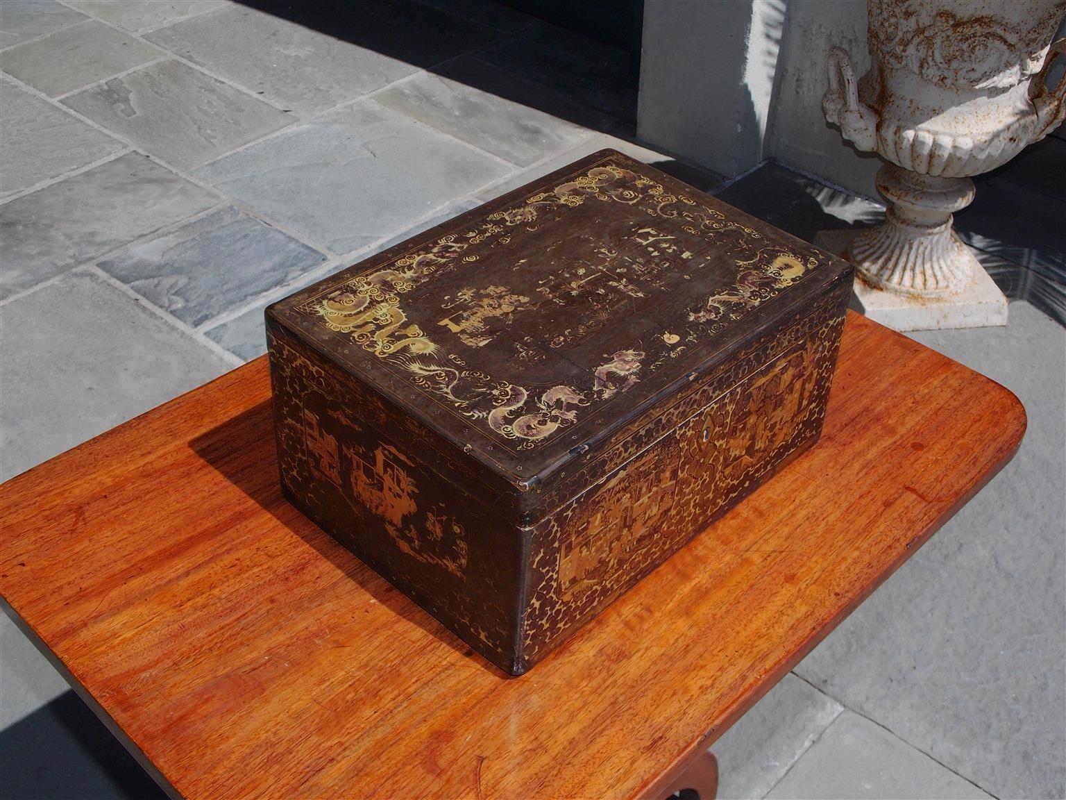 English black lacquered and gilt stenciled figural pagoda hinged tea box with exterior gilt stenciled dragon motif, original interior pewter hand chased figural container with bone knob, gilt stenciled foliage motif, and terminating on straight edge