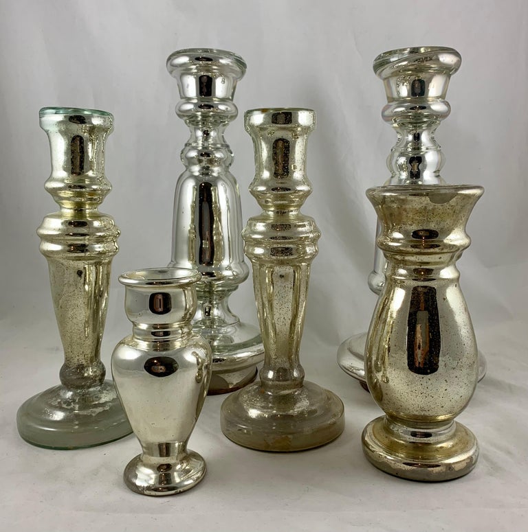 A beautiful collection of six Silvered Blown Mercury glass candlesticks, England, circa 1840-1855. 

Silvered Mercury glass is mouth-blown double walled, then silvered between the layers with a liquid silvering solution. The silvering is a heated