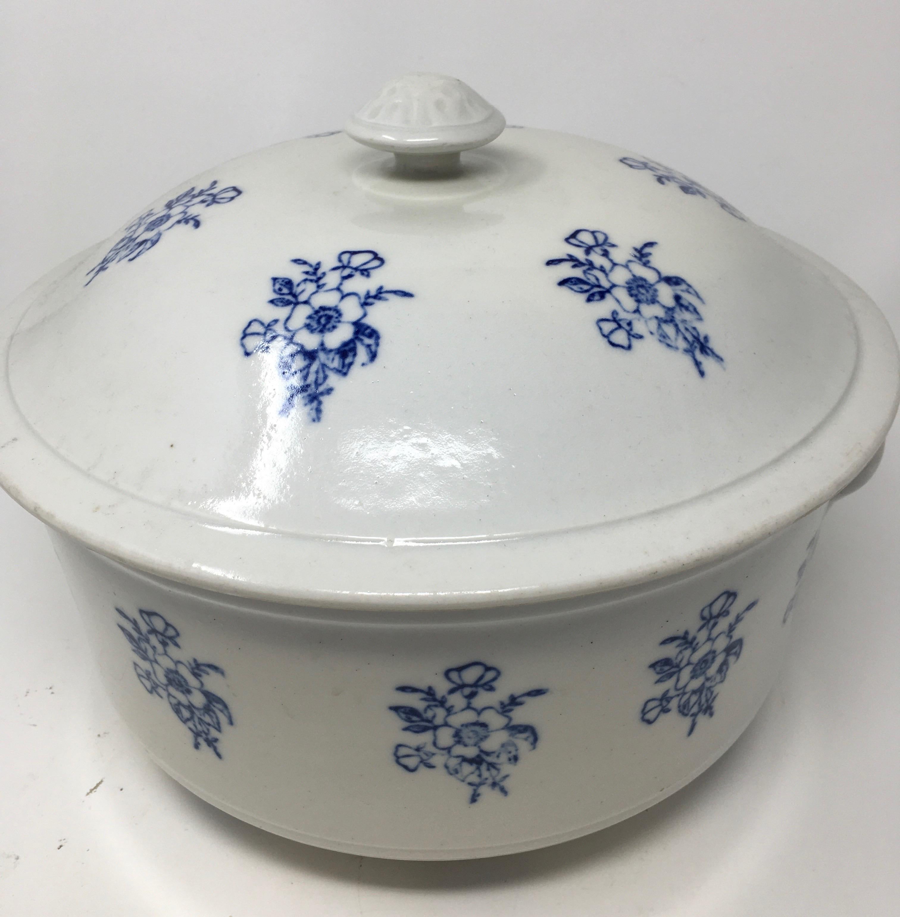 Found in England, this is a beautiful blue and white ironstone tureen. The piece, with blue transfer detailing has wonderful patina and is in very good condition, complete with its knob handle on the lid and two handles on the bowl.