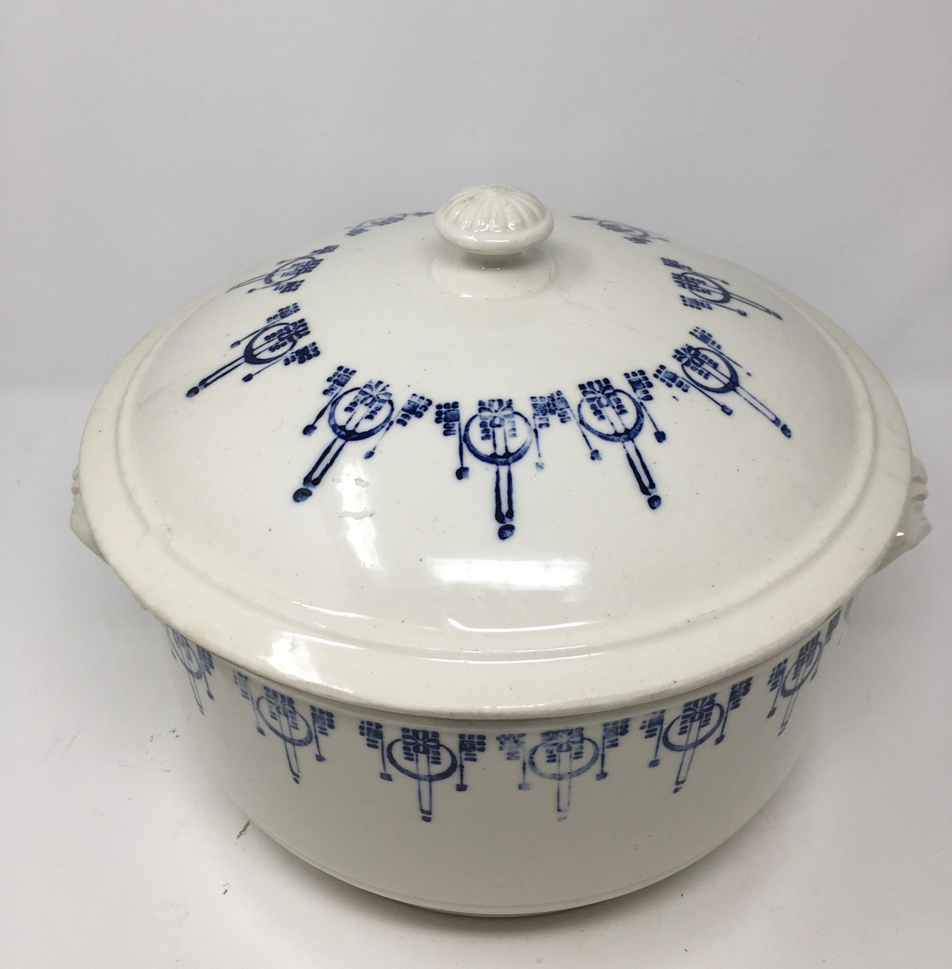 Found in England, this is a beautiful blue and white ironstone tureen. The piece, with blue transfer detailing has wonderful patina and is in very good condition, complete with its knob handle on the lid and two handles on the bowl.