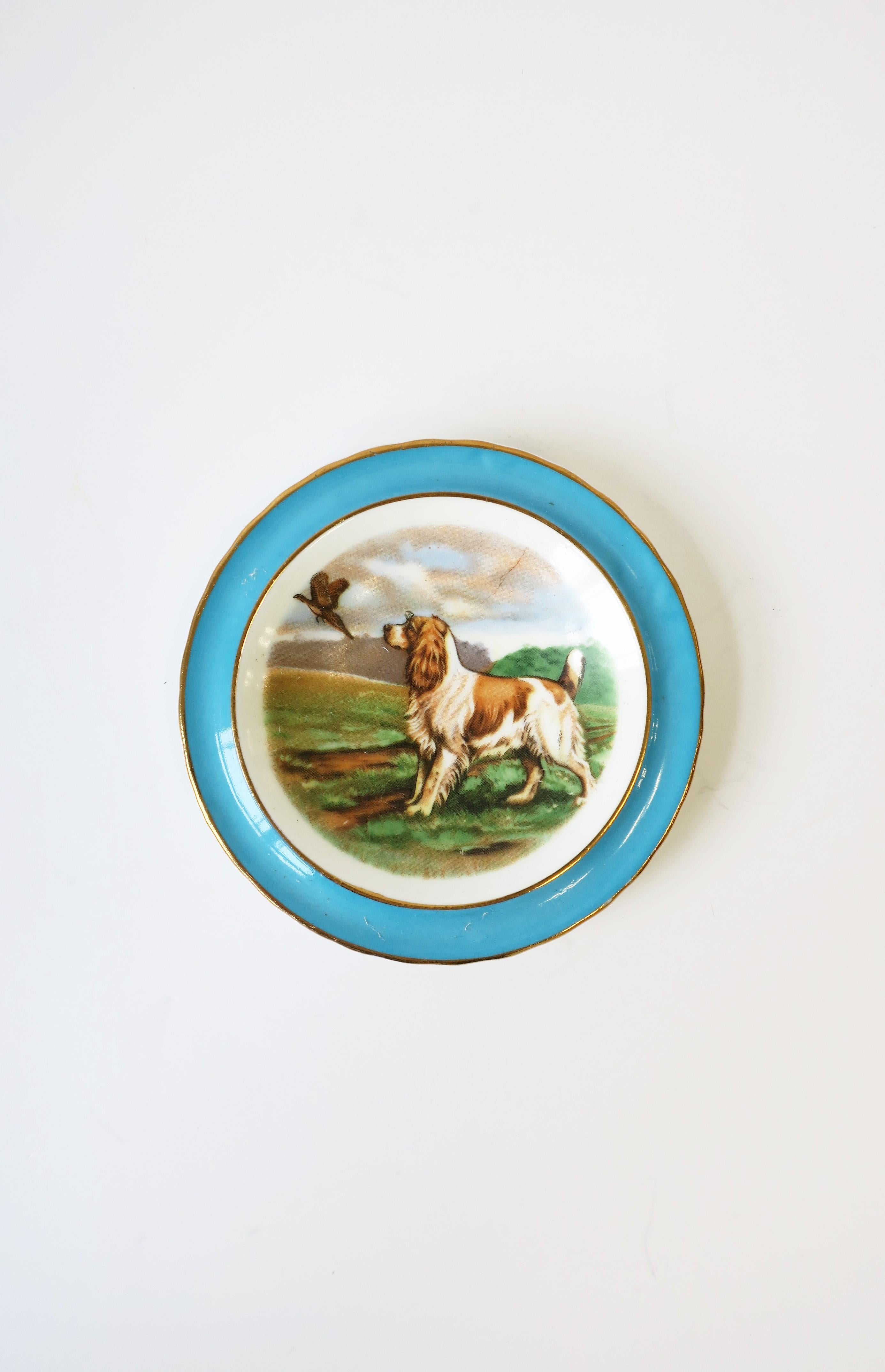 A very beautiful English blue and white porcelain jewelry dish with Spaniel dog and bird, circa early 20th century, England. A great piece to hold jewelry or other items on a vanity, desk, nightstand area, etc.

Piece measures: 4.13