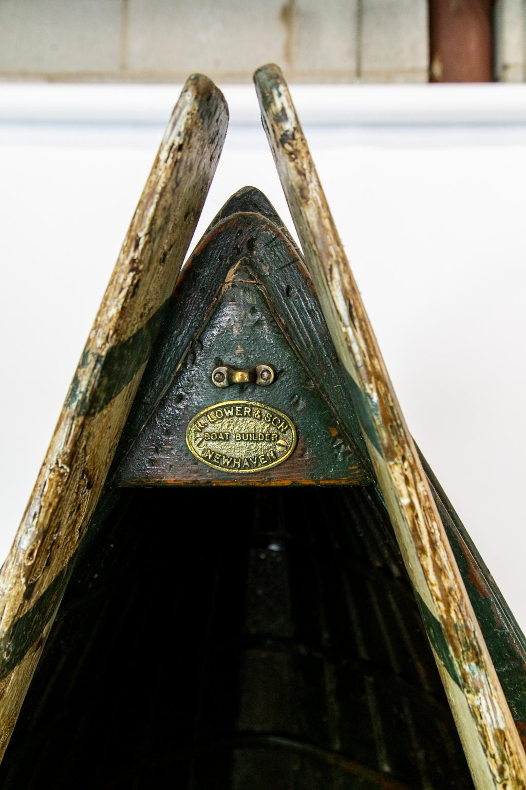 English boat shelf is made from an old boat hull with oars. It is signed by R. Lower and Sons boat builders, Newhaven.