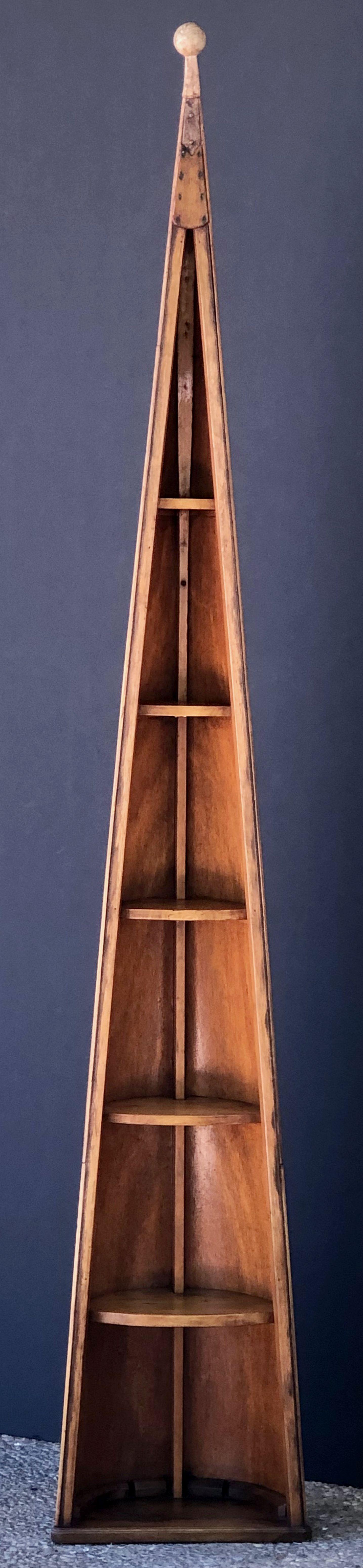 A fine English boat shelving unit or bookcase of mahogany, fashioned from a row boat skiff, or canoe, with six shelves of graduating size.

Marked: Thor

Dimensions:

Measures: H 88 inches
W 15 1/2 inches
D 9 inches

Great for a fishing