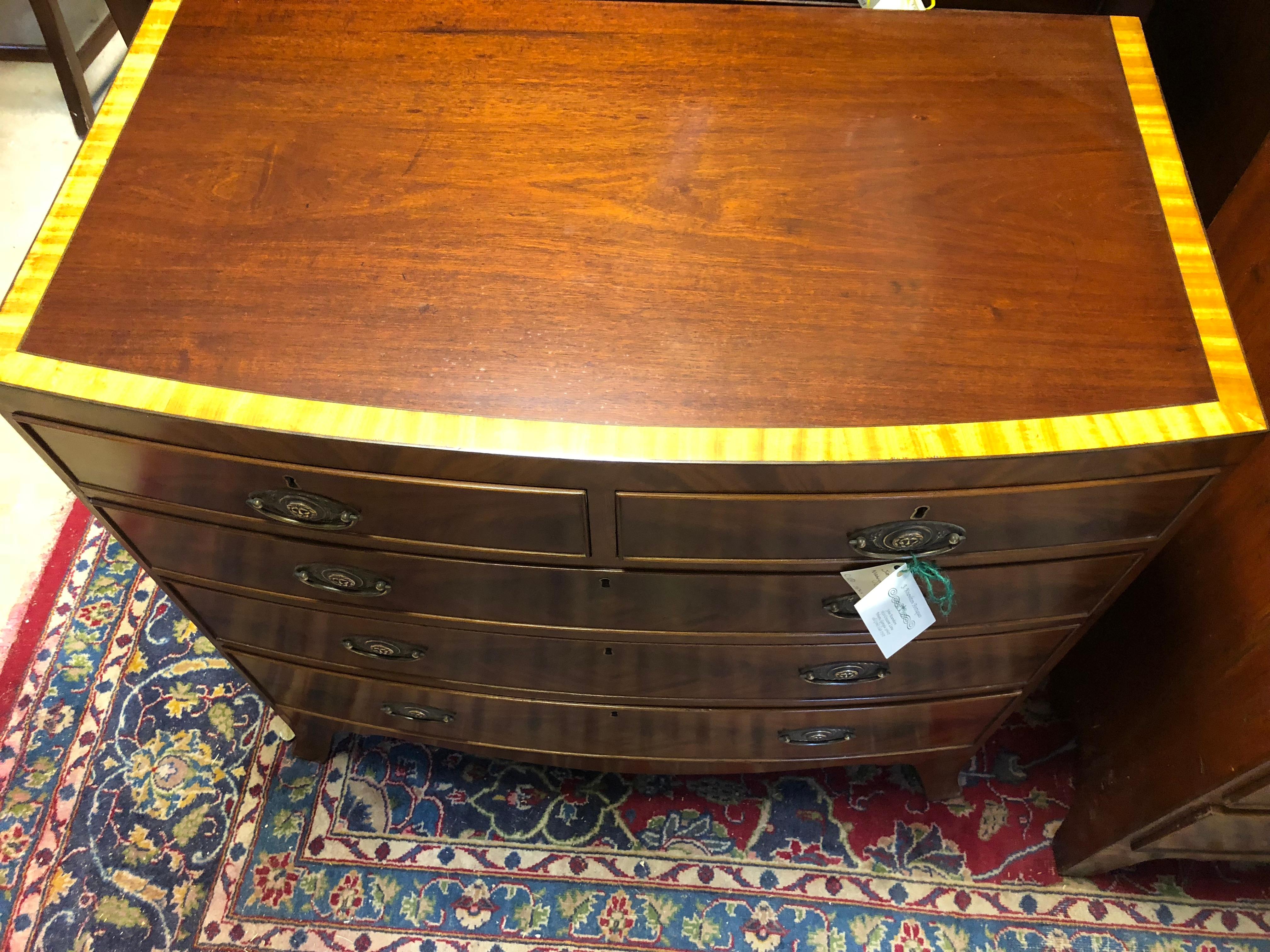 English bow front chest, caddy top, circa 1820, satin wood banding, period brass pulls, original skirt, oak lined, a very formal, showy chest in excellent condition.