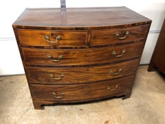 English Bow Front Chest in Mahogany with Banded Top and Chippendale Pulls