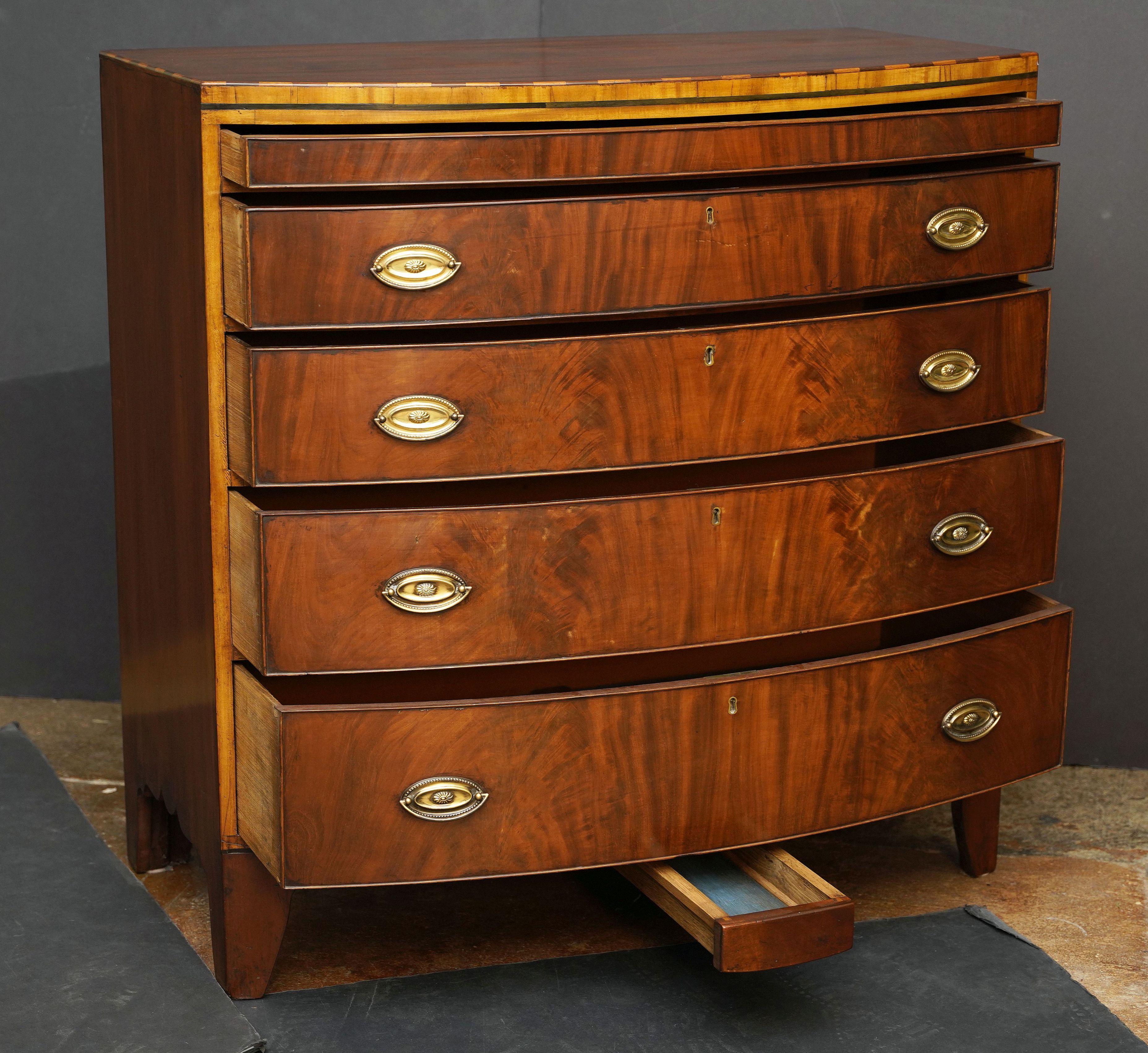 19th Century English Bow Front Chest of Inlaid Mahogany with Secret Drawers