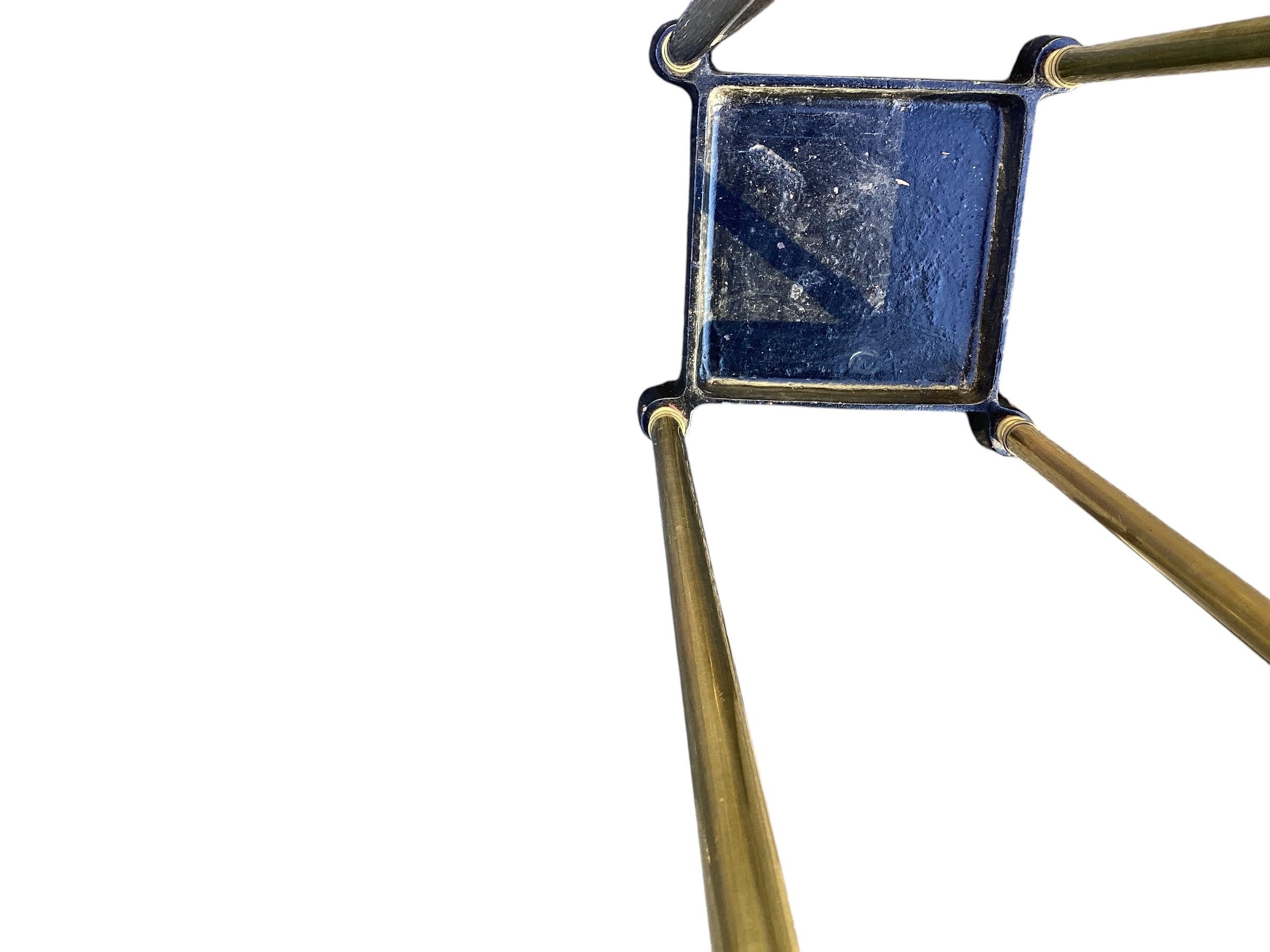 English Brass and Cast Iron Umbrella Stand. Simple design brass columns terminating in brass finial and a four slot construction with a cast iron base.
