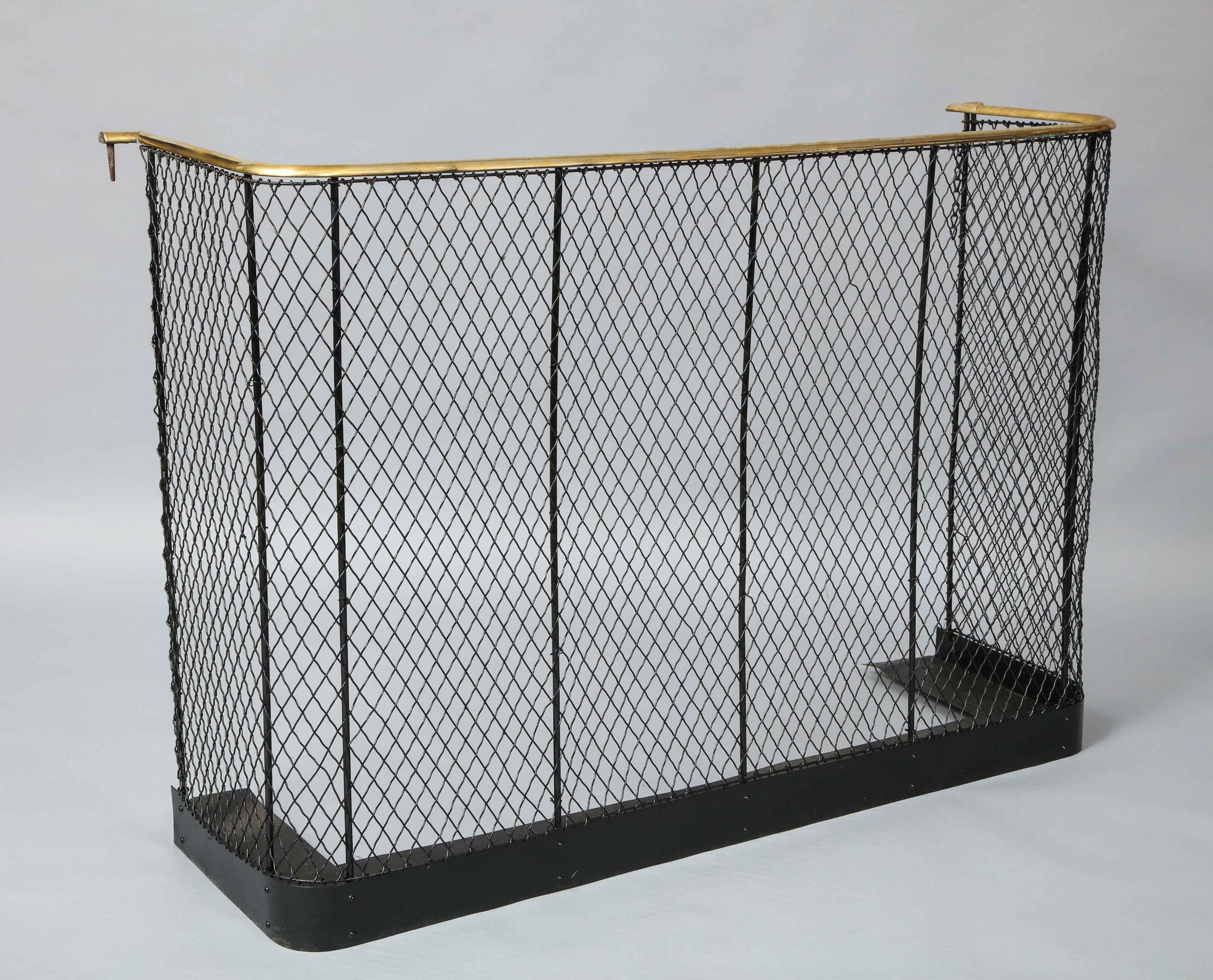 Very good quality English mid-19th century brass, wrought iron and wire nursery of heavy gauge construction, the brass rail over fishnet pattern wire work on sturdy wrought iron frame and with shaped iron plate forming platform base.

Measures: