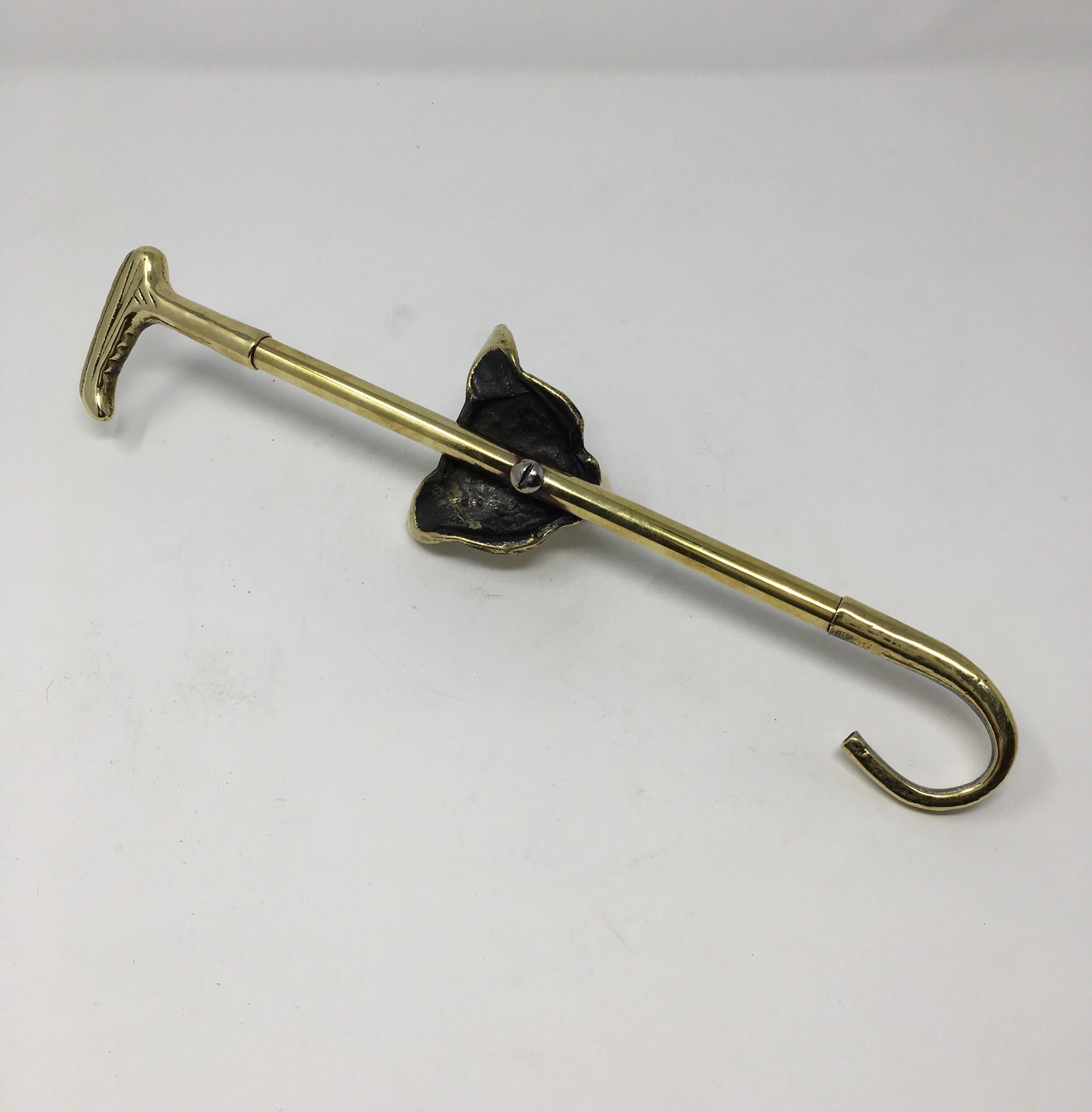 This is an English brass boot hook pull with a decorative fox. Boot pulls are used to aid in pulling on your boots by holding one end and slipping the hook into the leather loop inside your boot. This English boot pull is made of solid brass. This