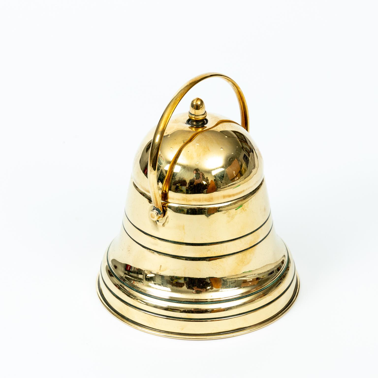 English brass caddy in the shape of a bell, circa mid-20th century. Made in England. Please note of wear consistent with age.

  