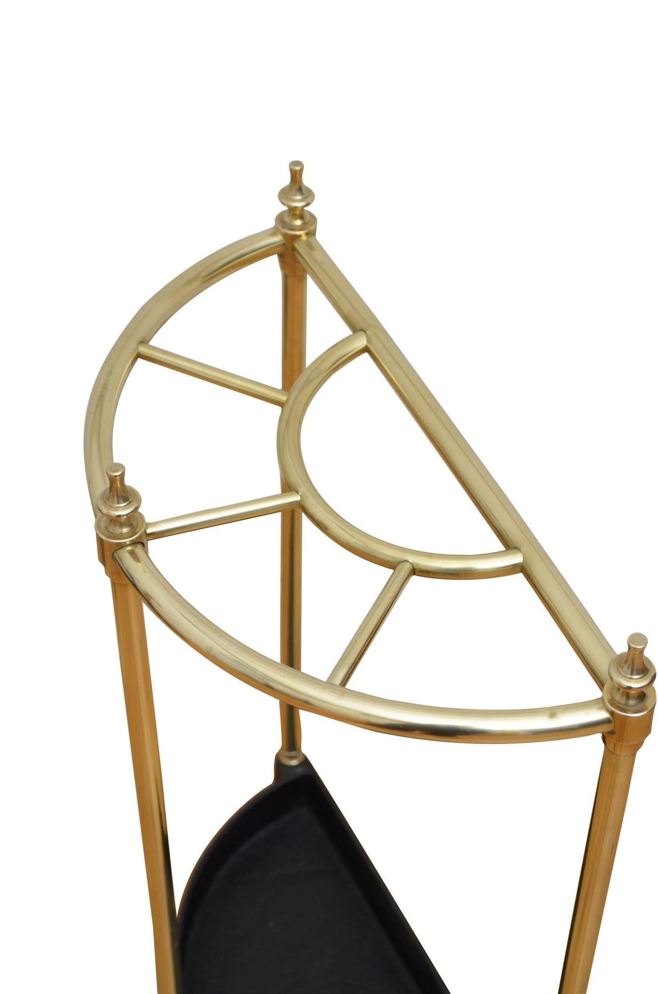 P0256  English half moon umbrella stand in brass, having five divisions with decorative finials and black drip tray raised on brass ball feet.. This umbrella stand has been cleaned and polished and is in home ready condition. c1960
Free delivery UK