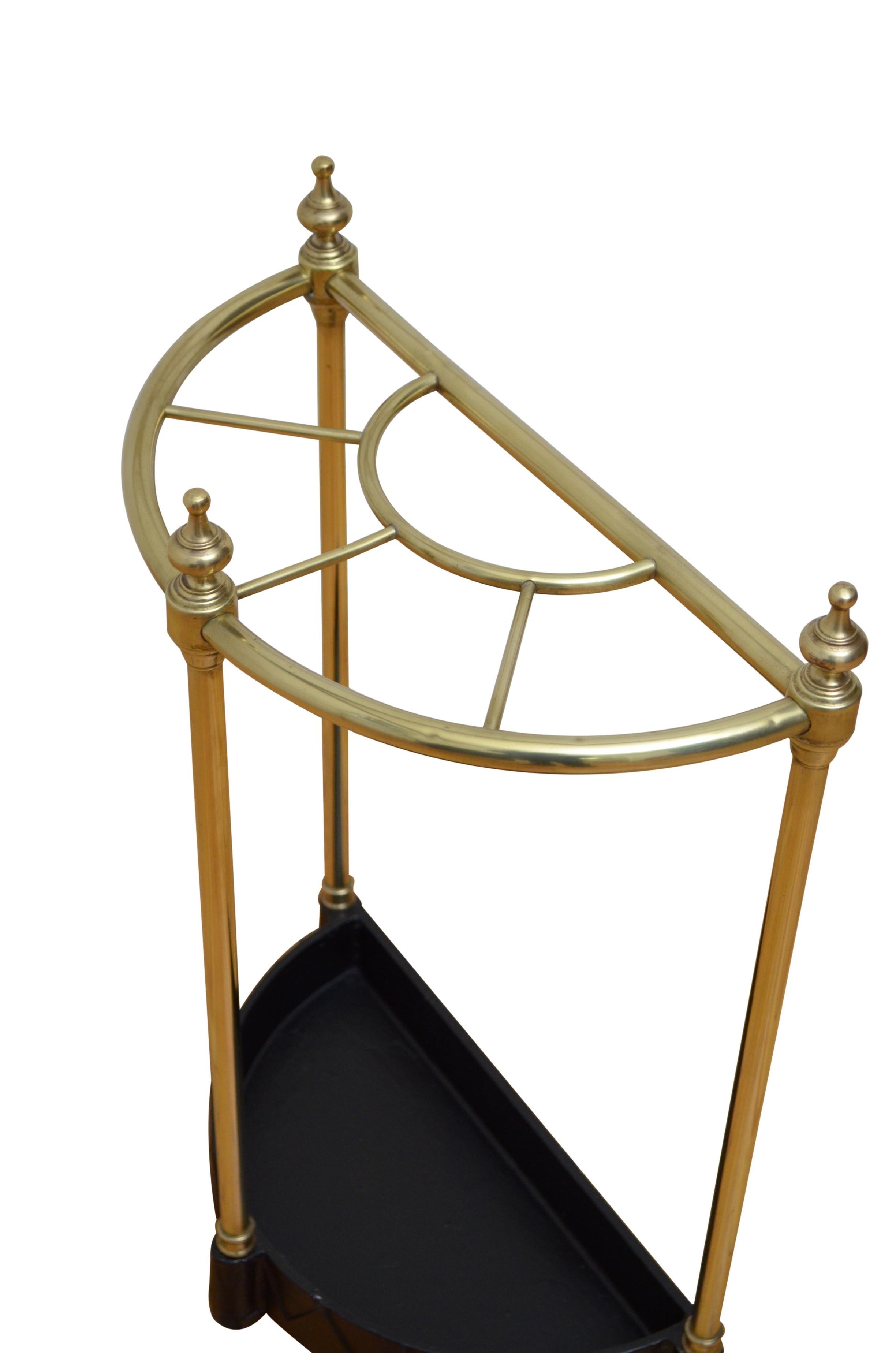 P0249 English half moon umbrella stand in brass, having five divisions with decorative finials and black drip tray with dog tooth decoration. This umbrella stand has been cleaned and polished and is in home ready condition. c1960
Free delivery UK