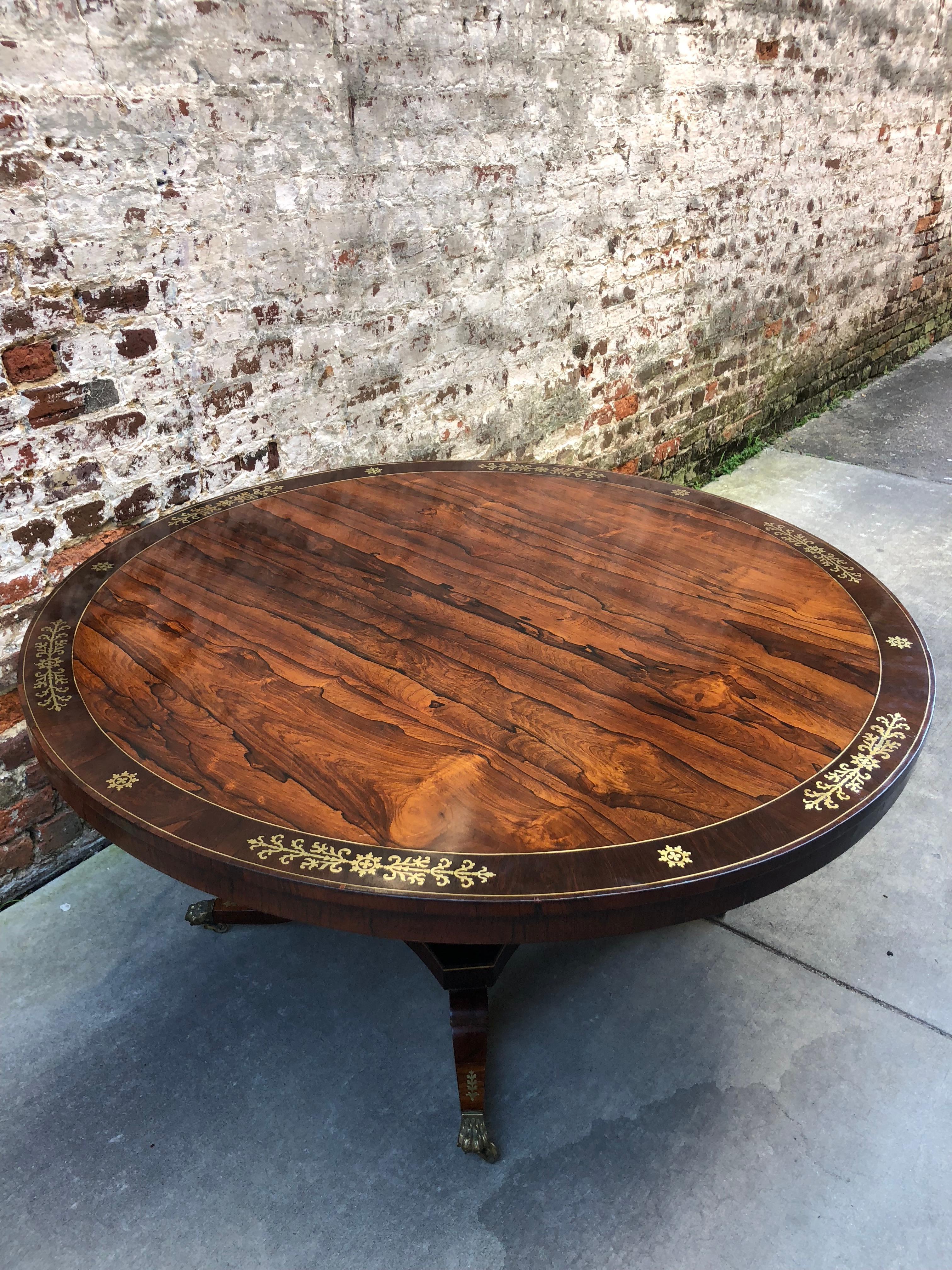 English brass inlaid rosewood center or dining table, circa 1830.