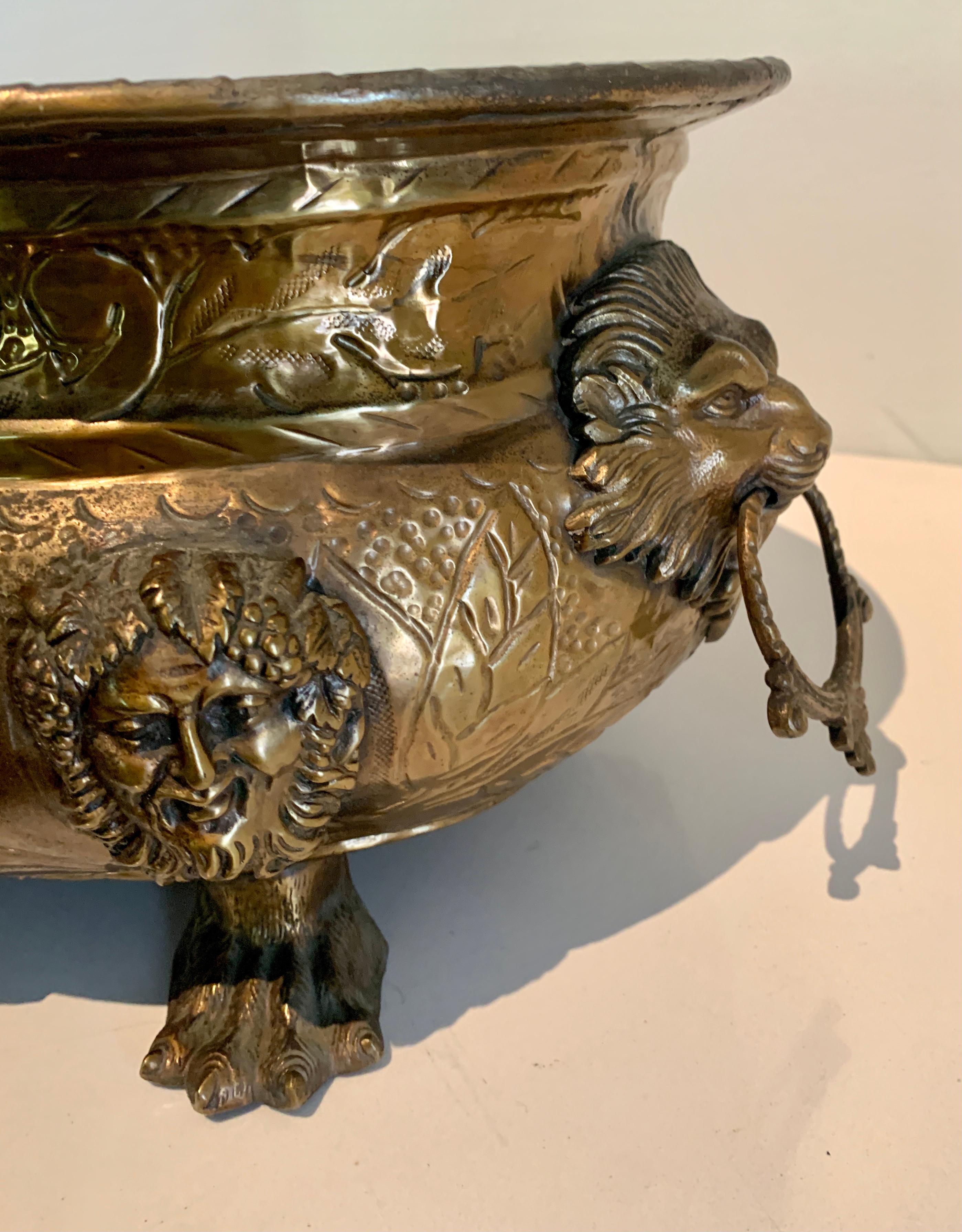 Repoussé English Brass Jardiniere with Lions Heads, Rings and Paw Feet Details