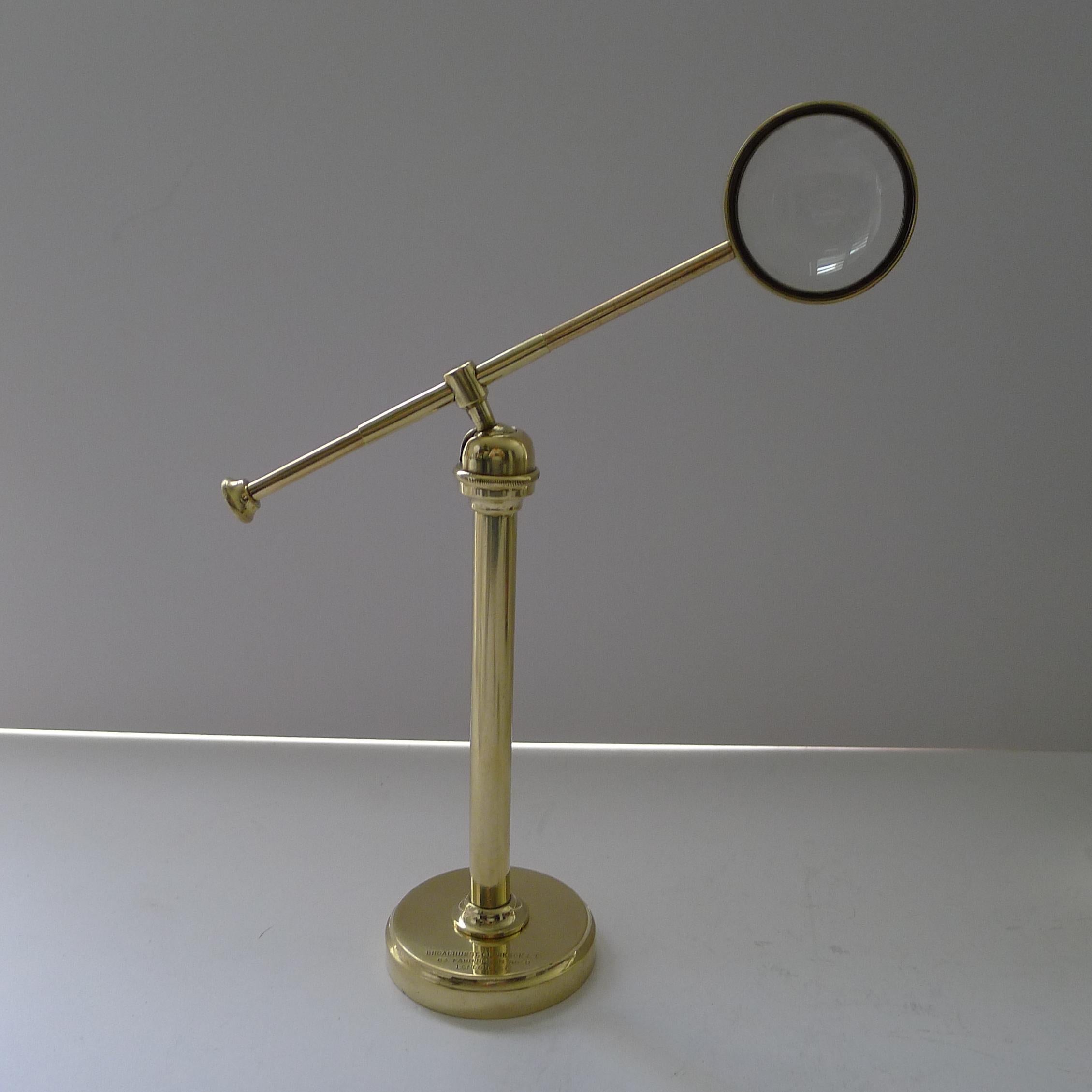 A handsome antique English magnifying glass on stand which pivots on a ball and socket fitting, moving around with ease.

Dating to c.1915, it remains in excellent condition having been professionally cleaned and polished, restoring it to it's