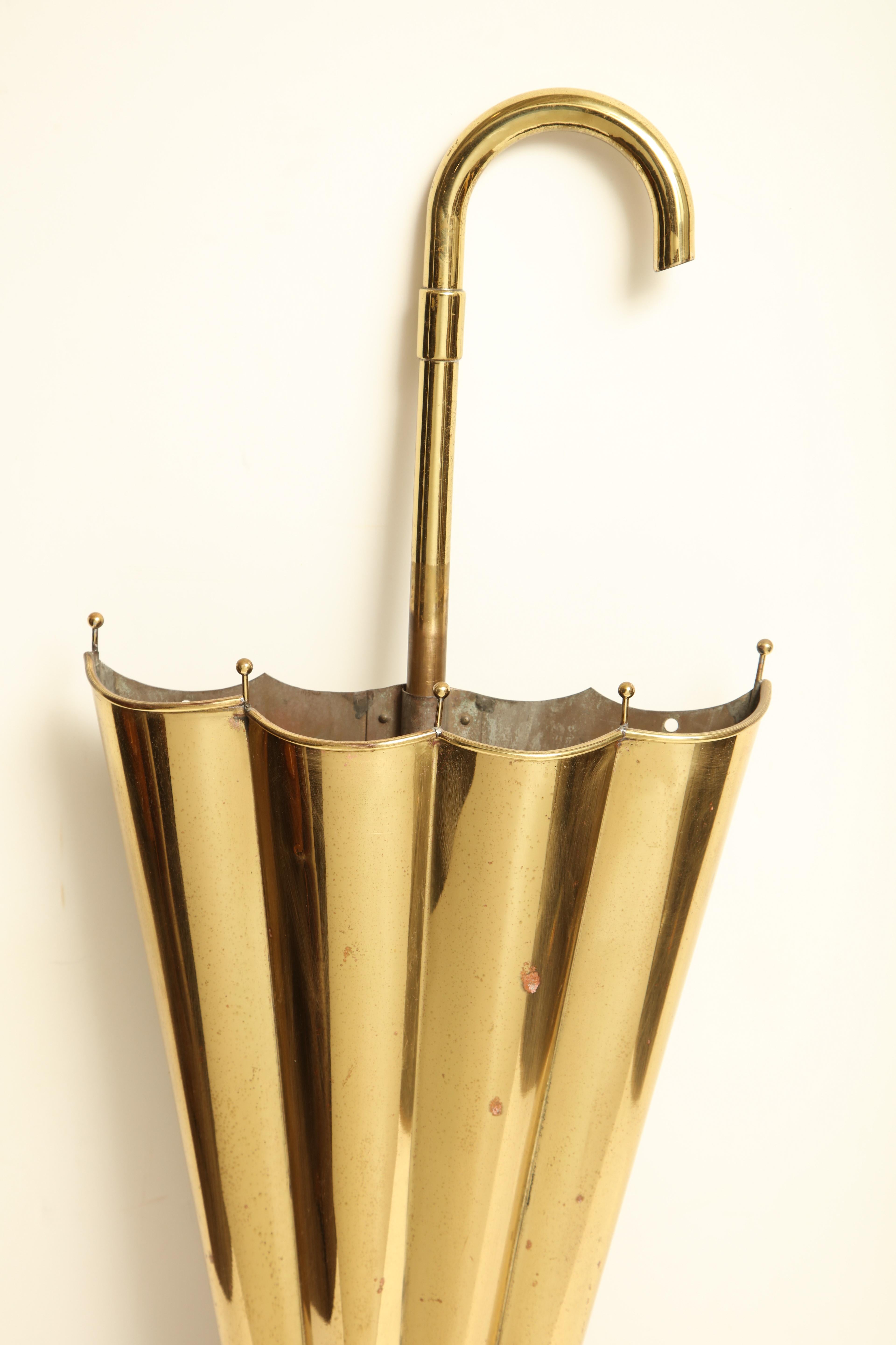 English, umbrella stand in brass
Cork on bottom to release water.
