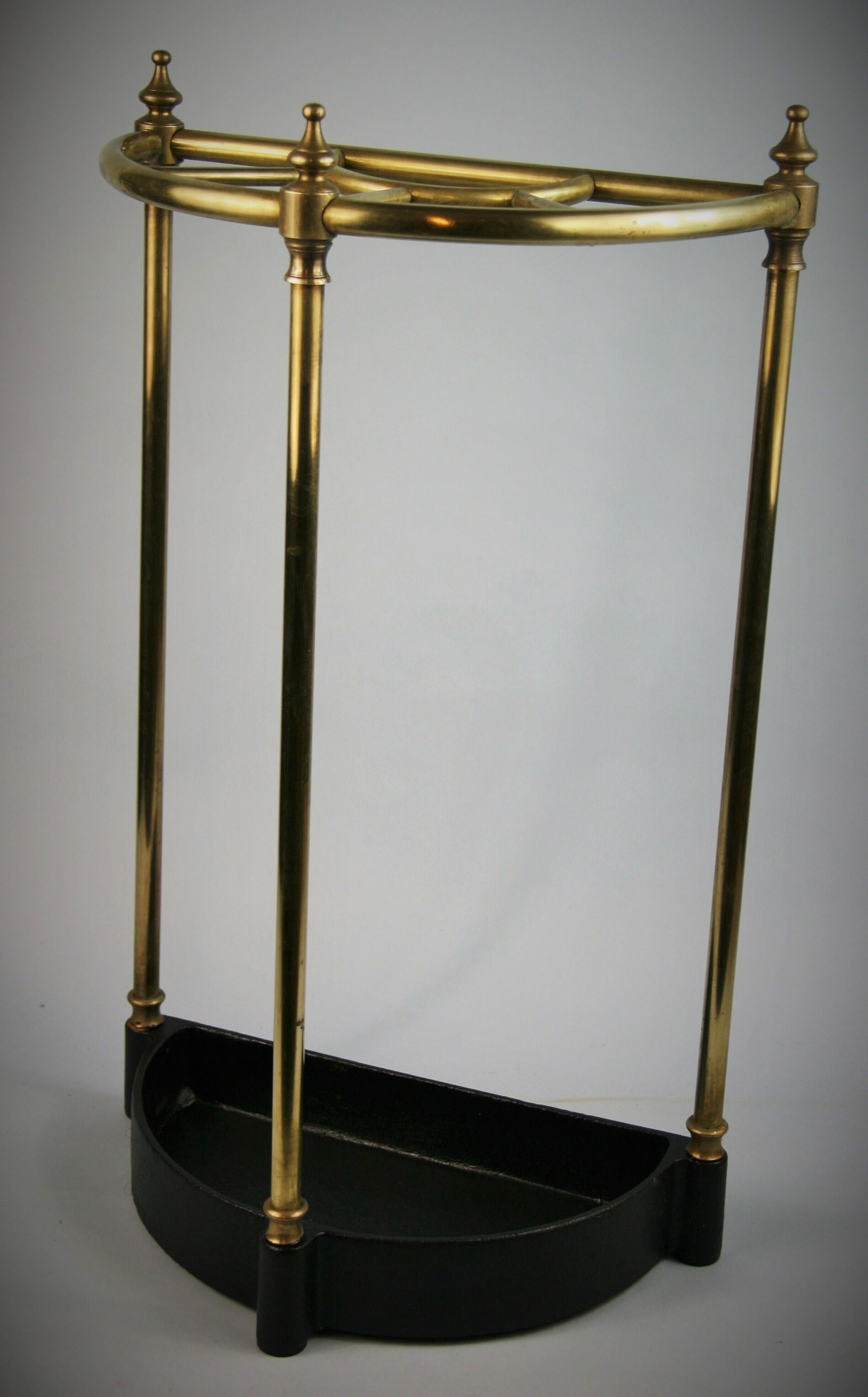 3-566 English solid bass with cast iron base 5 compartment umbrella /cane stand.