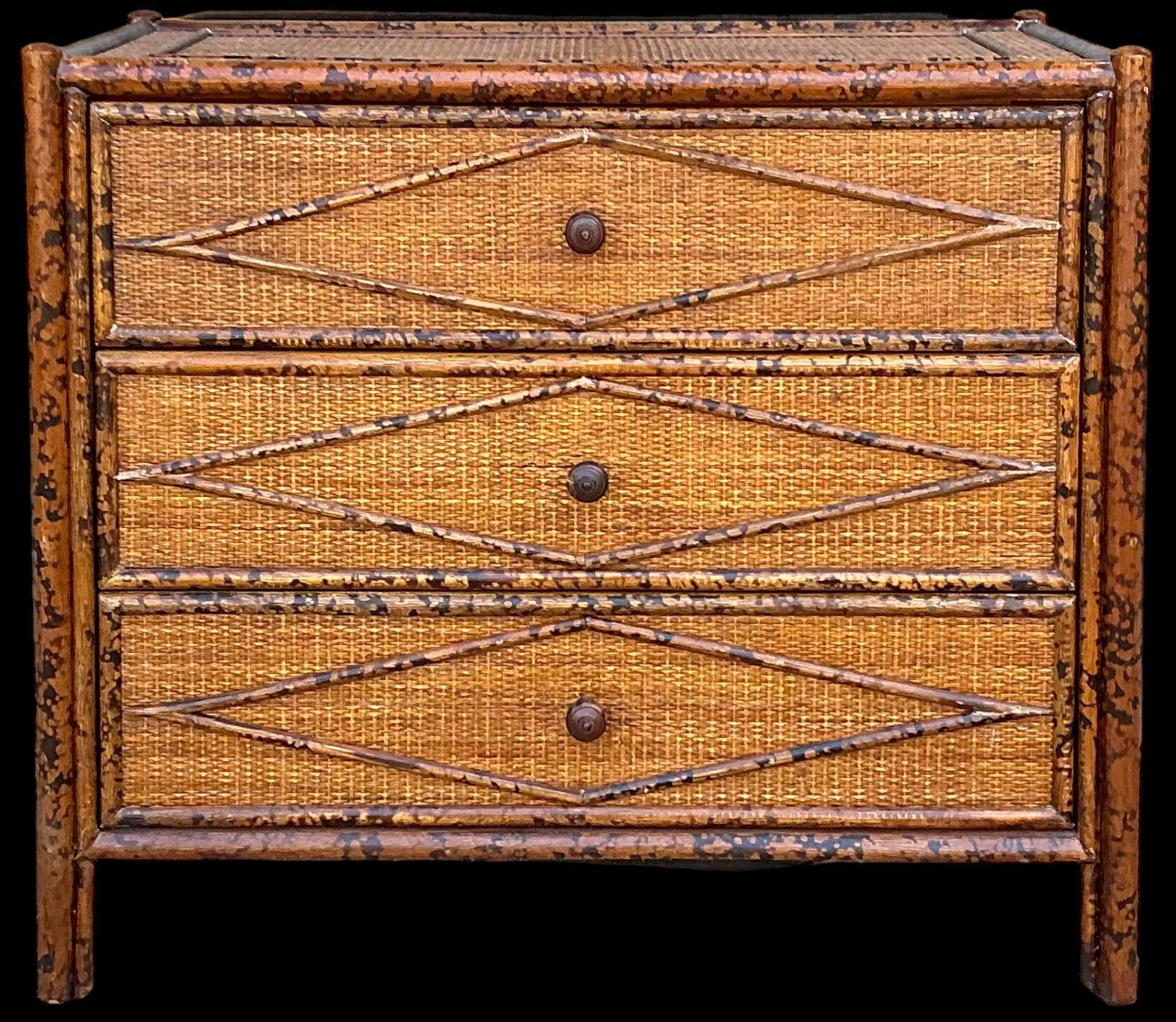 This is a British Colonial style burnt bamboo or faux tortoise finished chest or commode. It is wrapped in a woven grasscloth. The piece dates to the later part of the 20th century and is unmarked. It is in very good condition. 

My shipping is