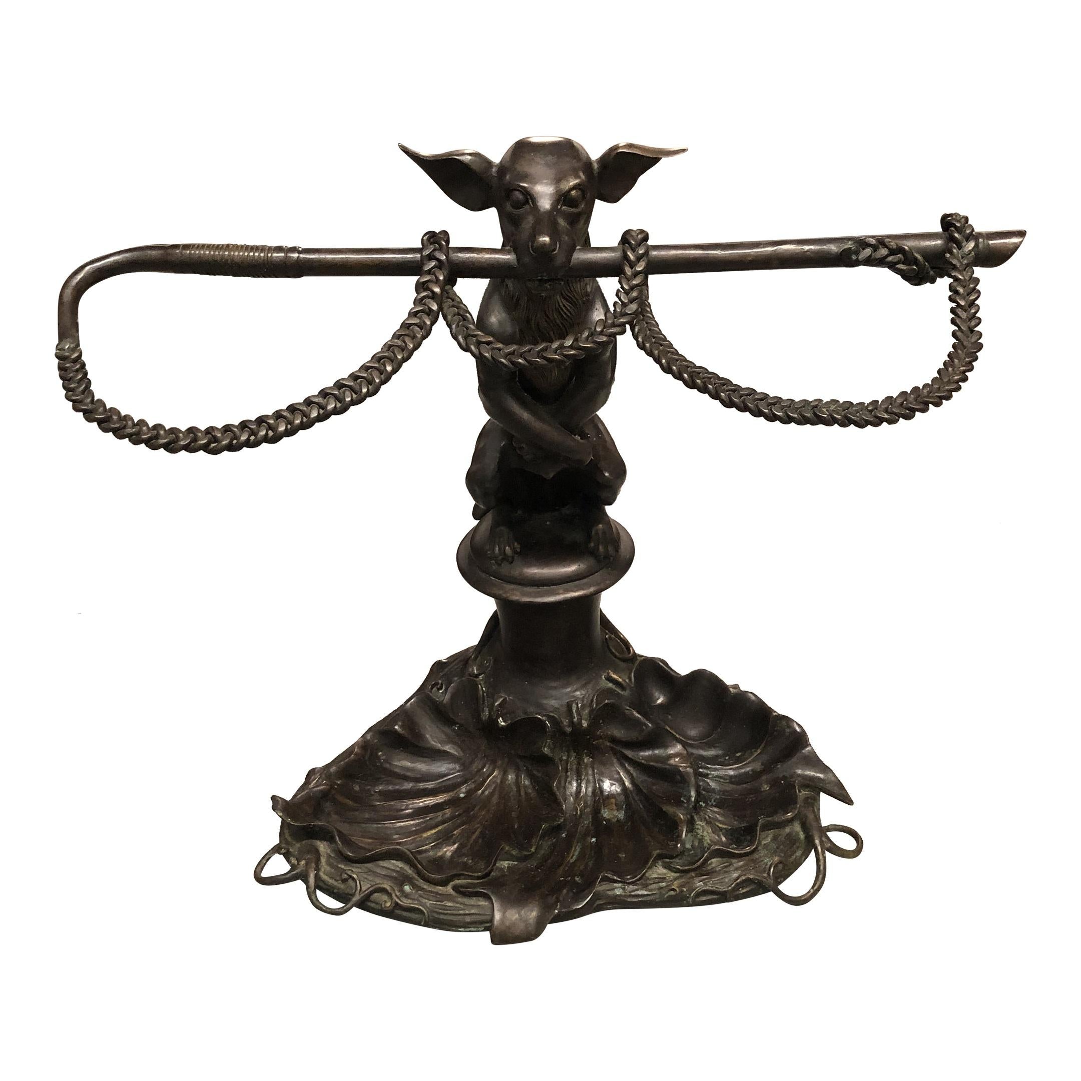 English, 20th century. 
A vintage bronze dog form umbrella stand or cane holder with lily pad base after the original by Coalbrookdale. 
Approx: 20