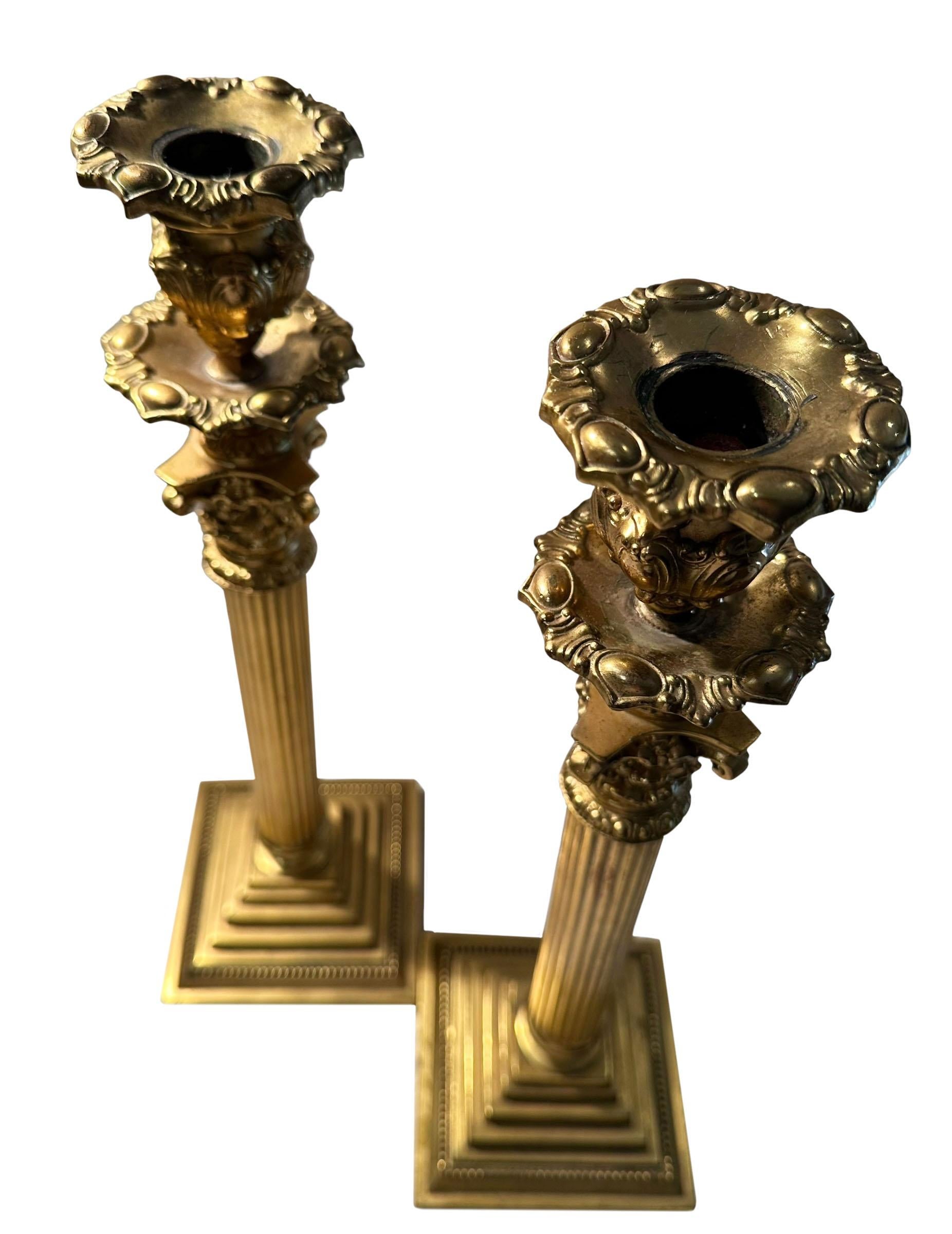 A pair of bronze dore candlesticks from England, circa 1840s. They are bronze dore with lead inside the bottom.
