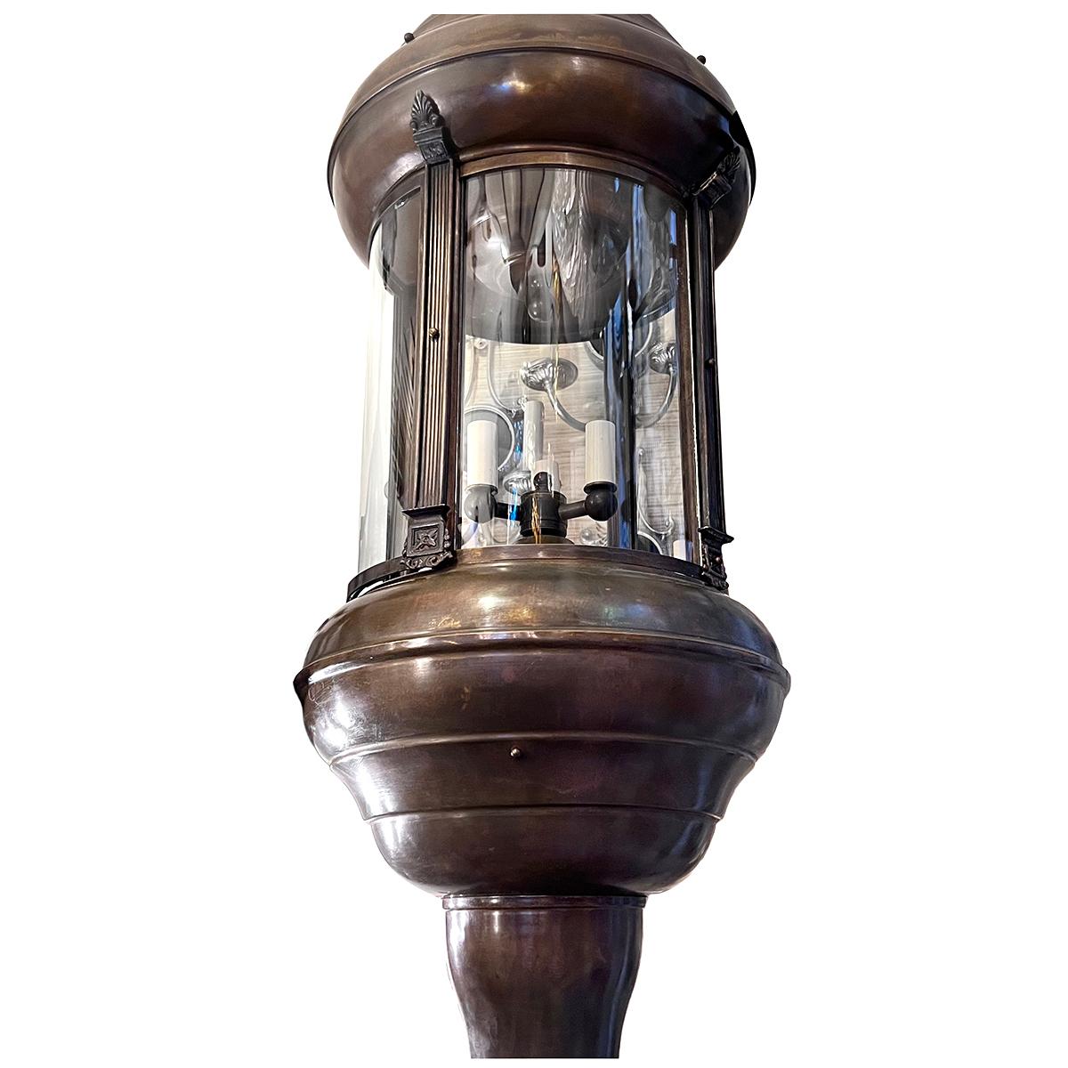A circa 1940's patinated bronze neoclassic lantern with 3 candelabra lights.

Measurements:
Diameter: 15