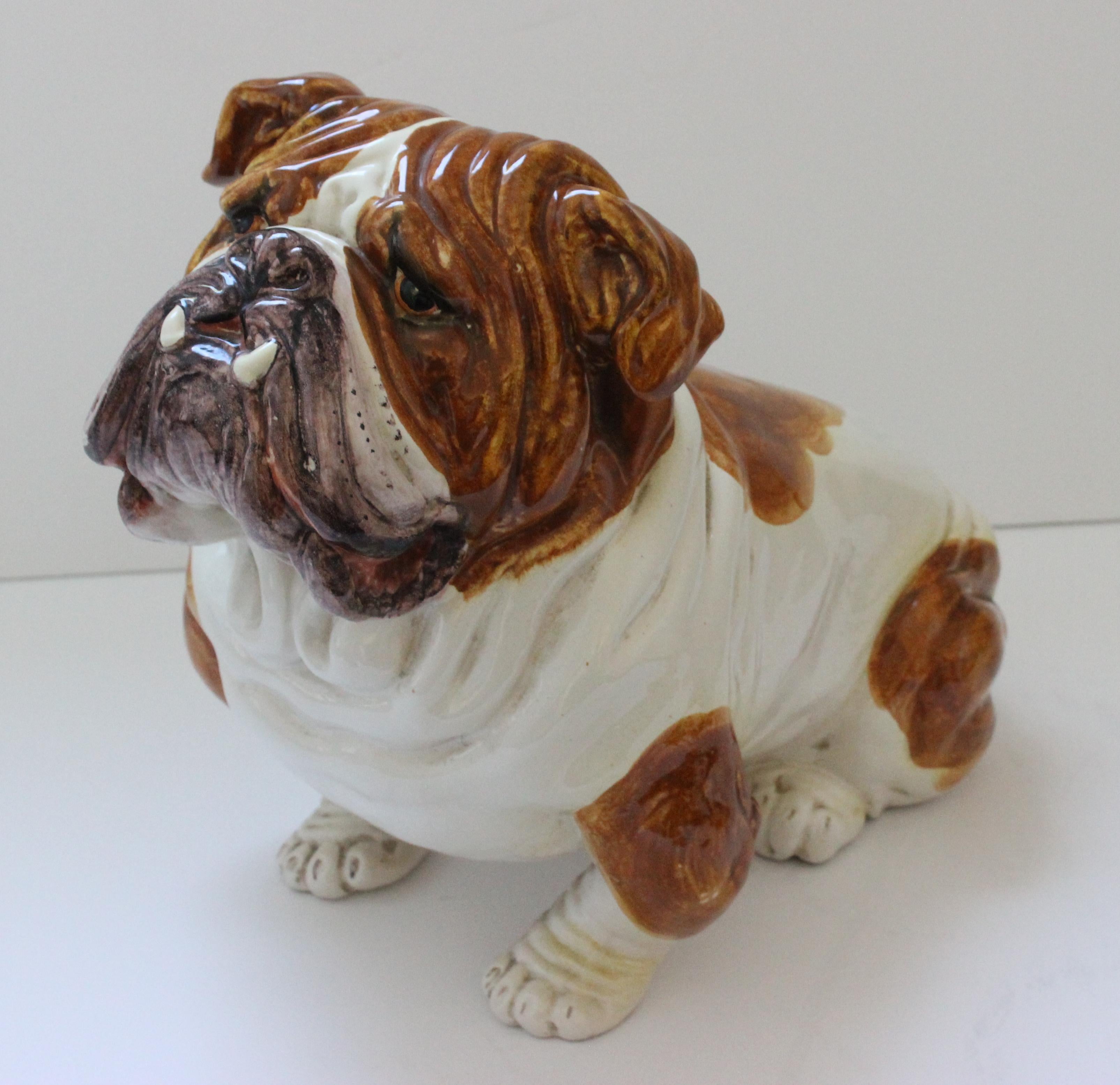 This stylish and charming figure of a bull dog dates to the 1960s-1970s and was created in Italy. The piece is made of ceramic and hand painted by an artisan. 

Note: Marked Italy on the verso of one paw (see image #9).