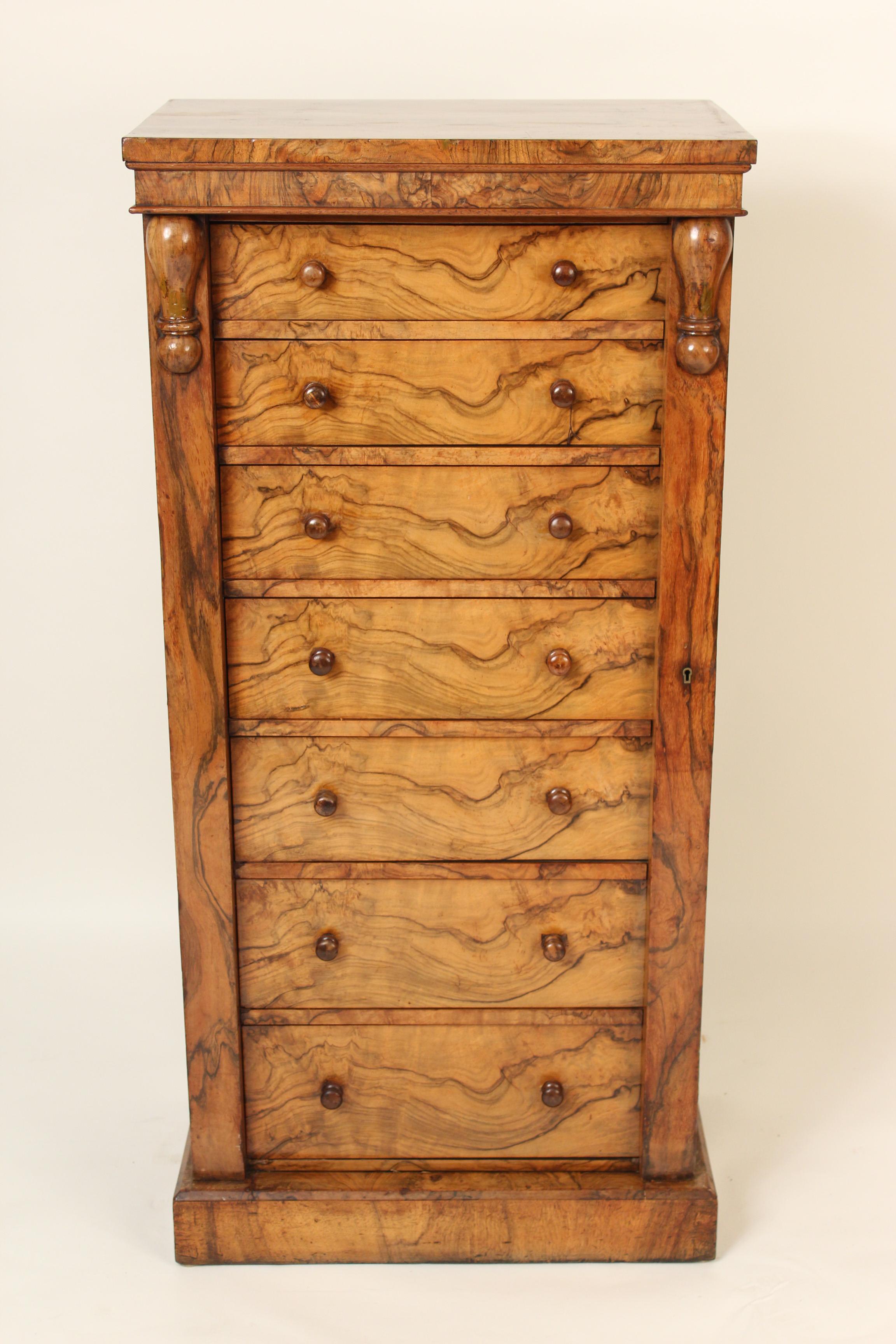 English burl walnut seven-drawer Wellington chest, late 19th century.