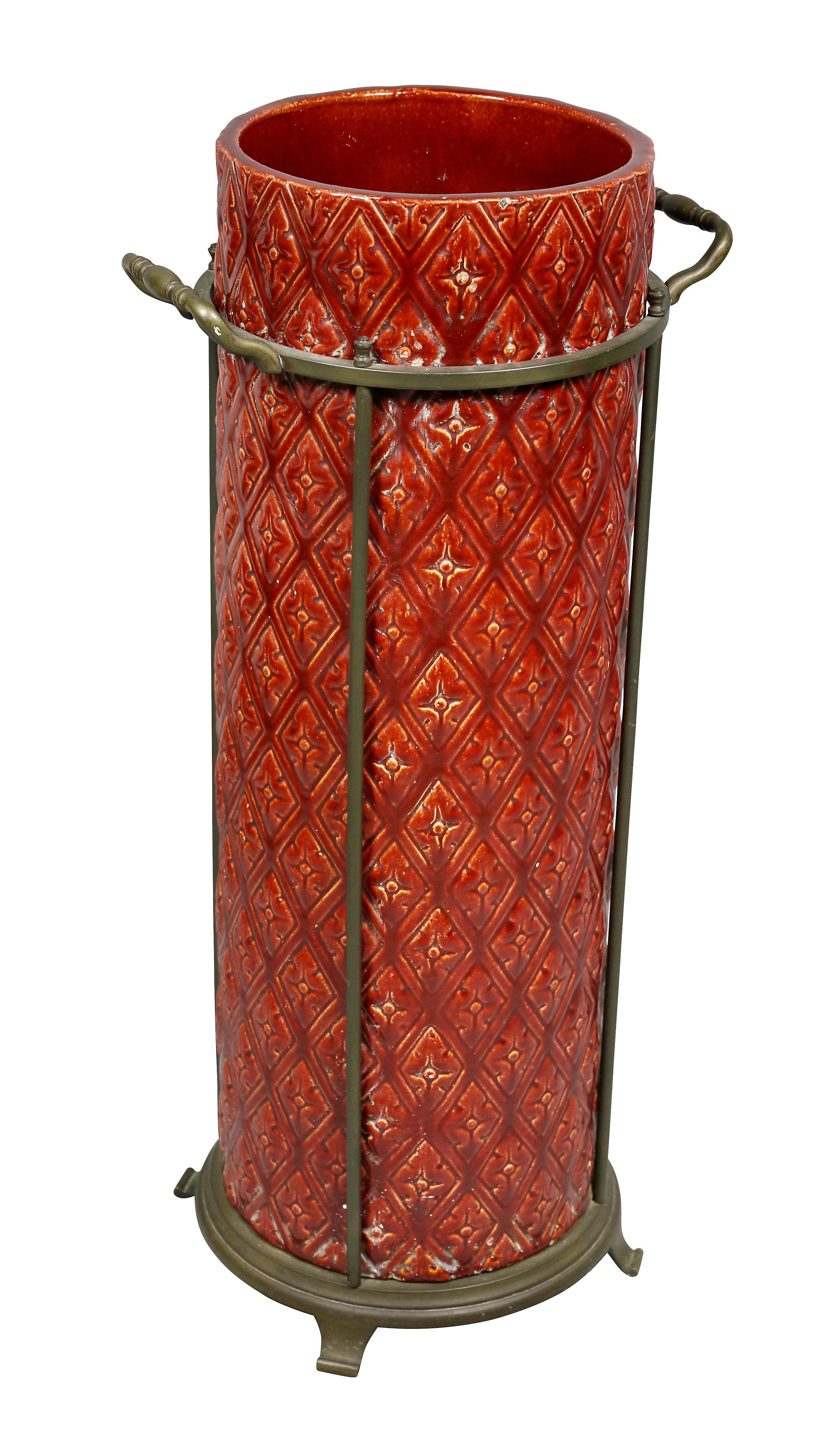 Red glaze with trellis pattern set within a brass holder with handles. Signed on base. Provenance; Dodo Dorrance Hamilton.