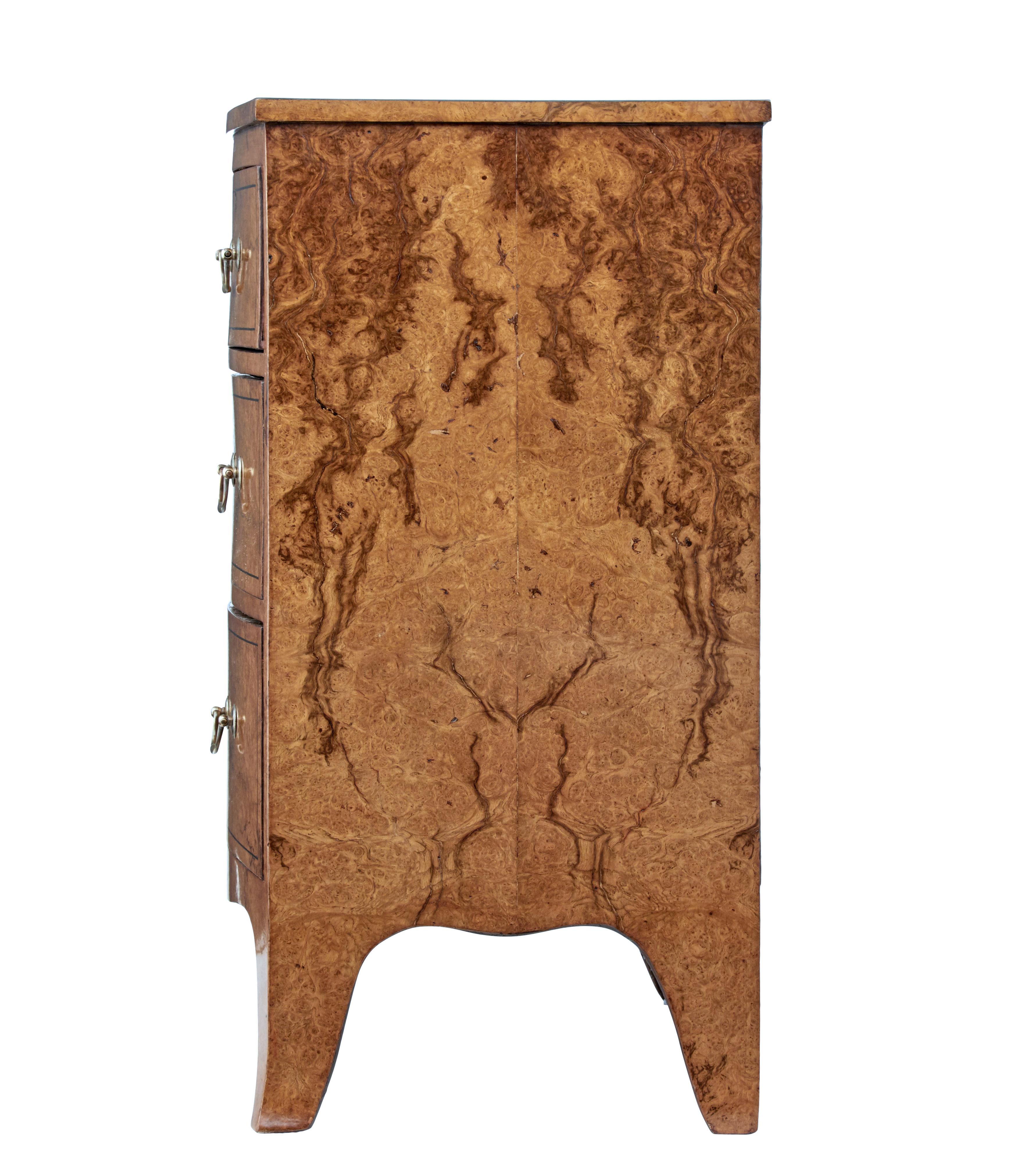 English burr walnut bow front chest circa 1870 with bookmatched veneer on the sides, four drawers, and splayed bracket feet. Delight in the distinguished allure of this English 19th century burr walnut bow front chest of drawers, circa 1870. This