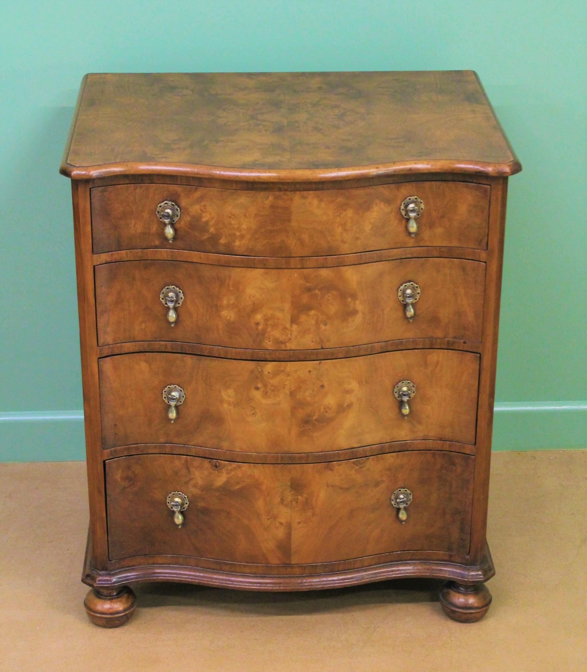 A delightful burr walnut serpentine fronted chest of drawers in the William and Mary style. Of good construction in solid walnut with attractive burr walnut veneers and of compact proportions. With a series of 4 graduated drawers all fitted with