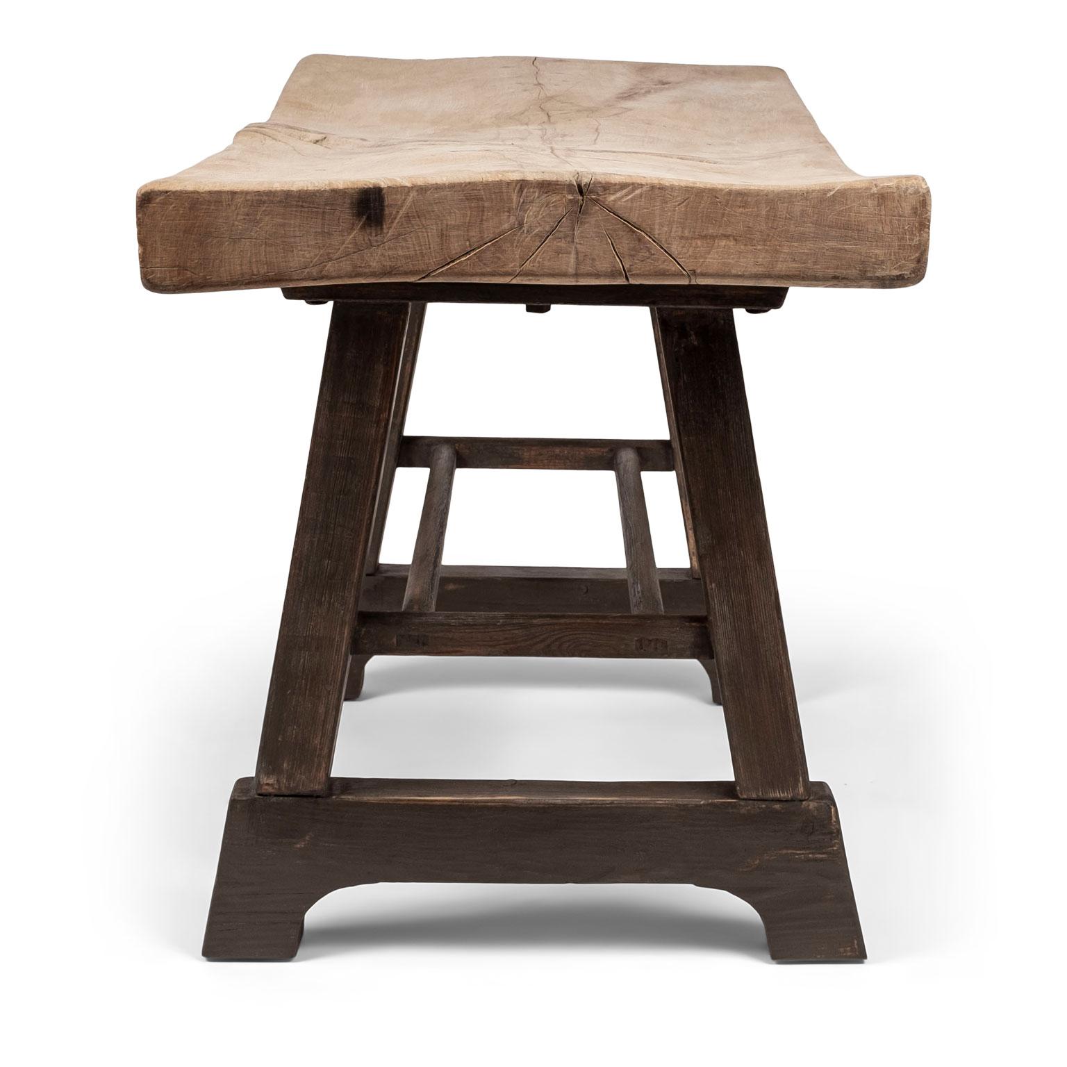 English butchers block table from a country house in Leicestershire. Constructed in the late 19th century with large, wide top made from one single solid piece of scrubbed pale sycamore, worn by a century of steady use to varying degrees of