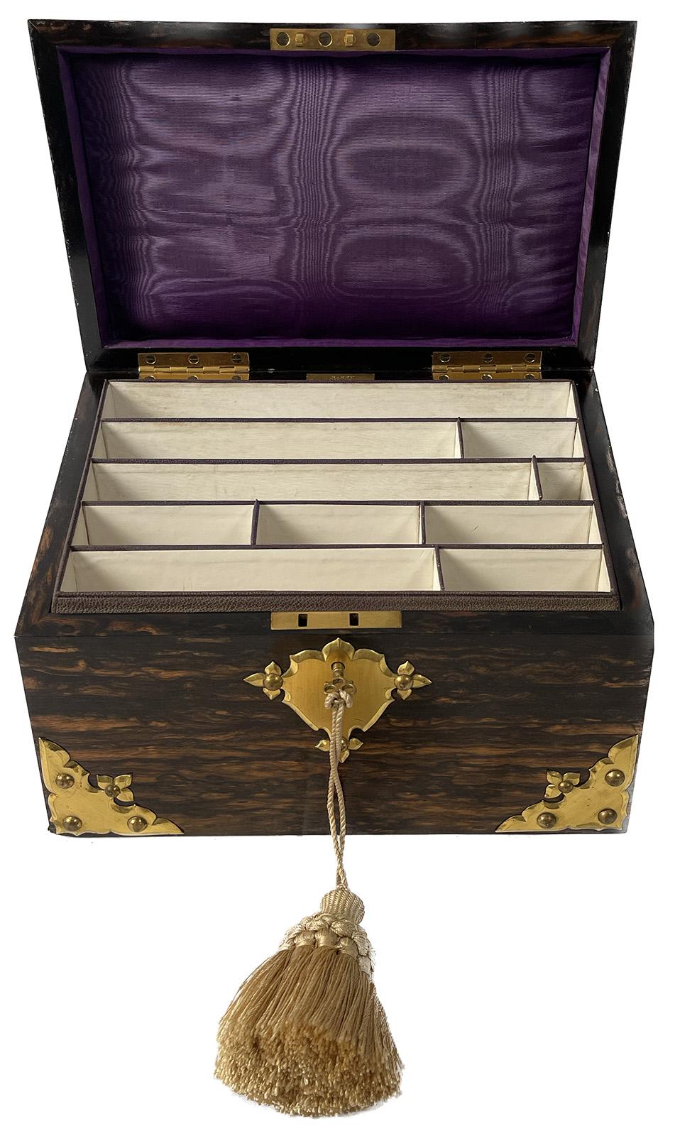 An English filing box made from calamander wood with brass and malachite fittings, circa 1870. Inside is lined with fabric and bottom of box is padded with velvet.

Dimensions: 5.75