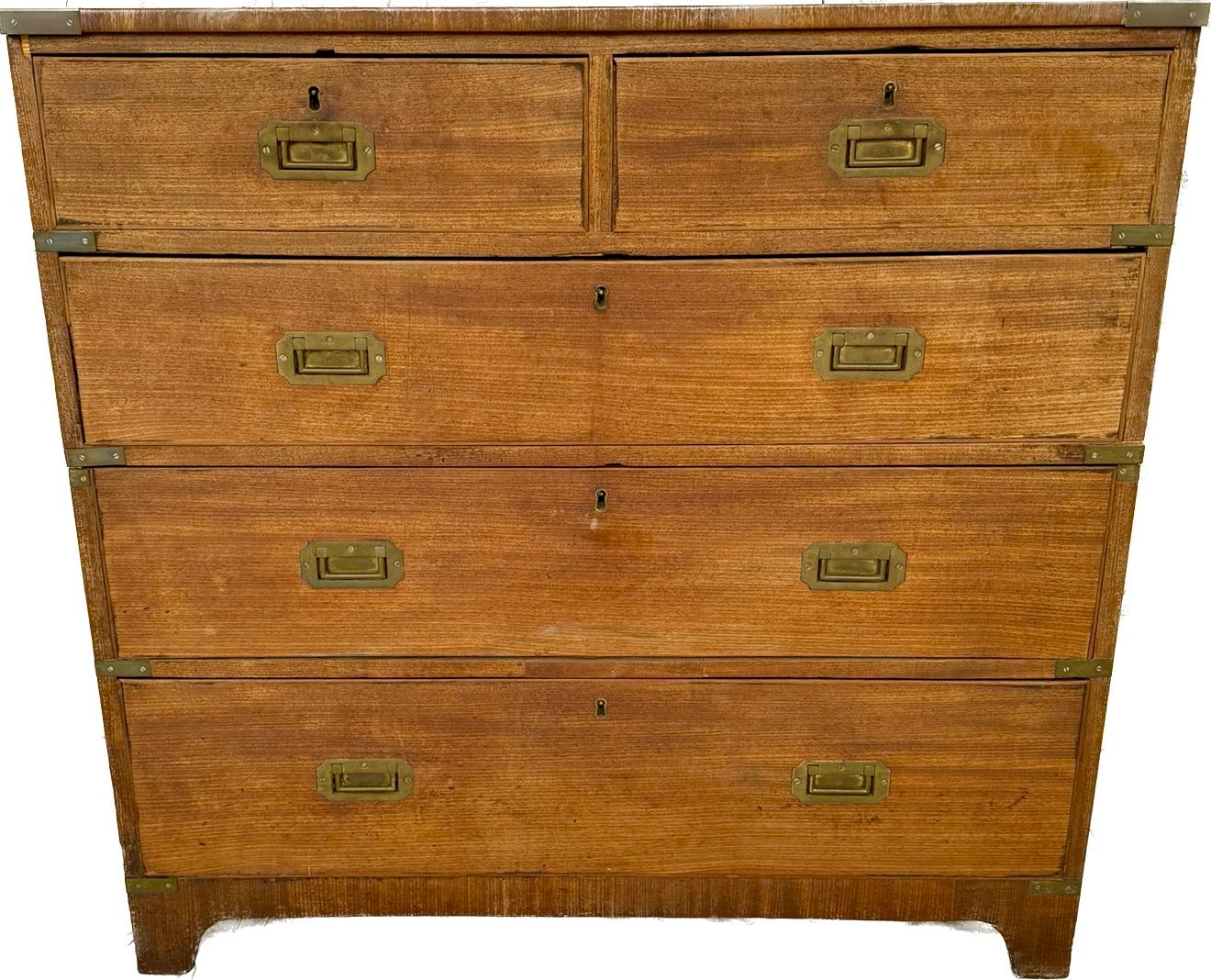 19th century English Campaign Chest. Chest of drawers has two drawers on top of three larger, more substantial drawers. Campaign chest splits into two sections which was used for ease of transportation in military campaigns. Chest is made of