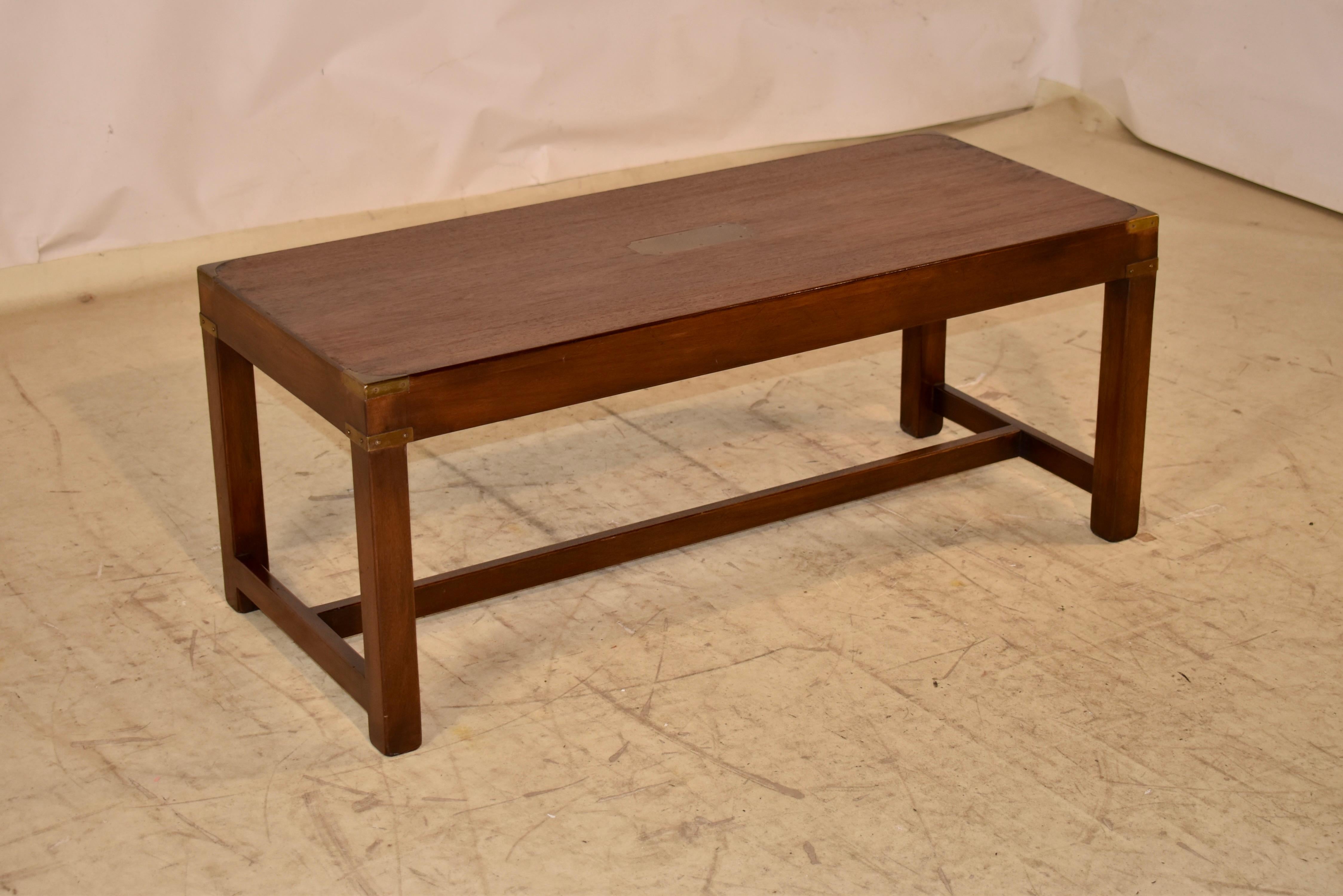 English Campaign style coffee table made from mahogany and banded in brass, circa 1950.