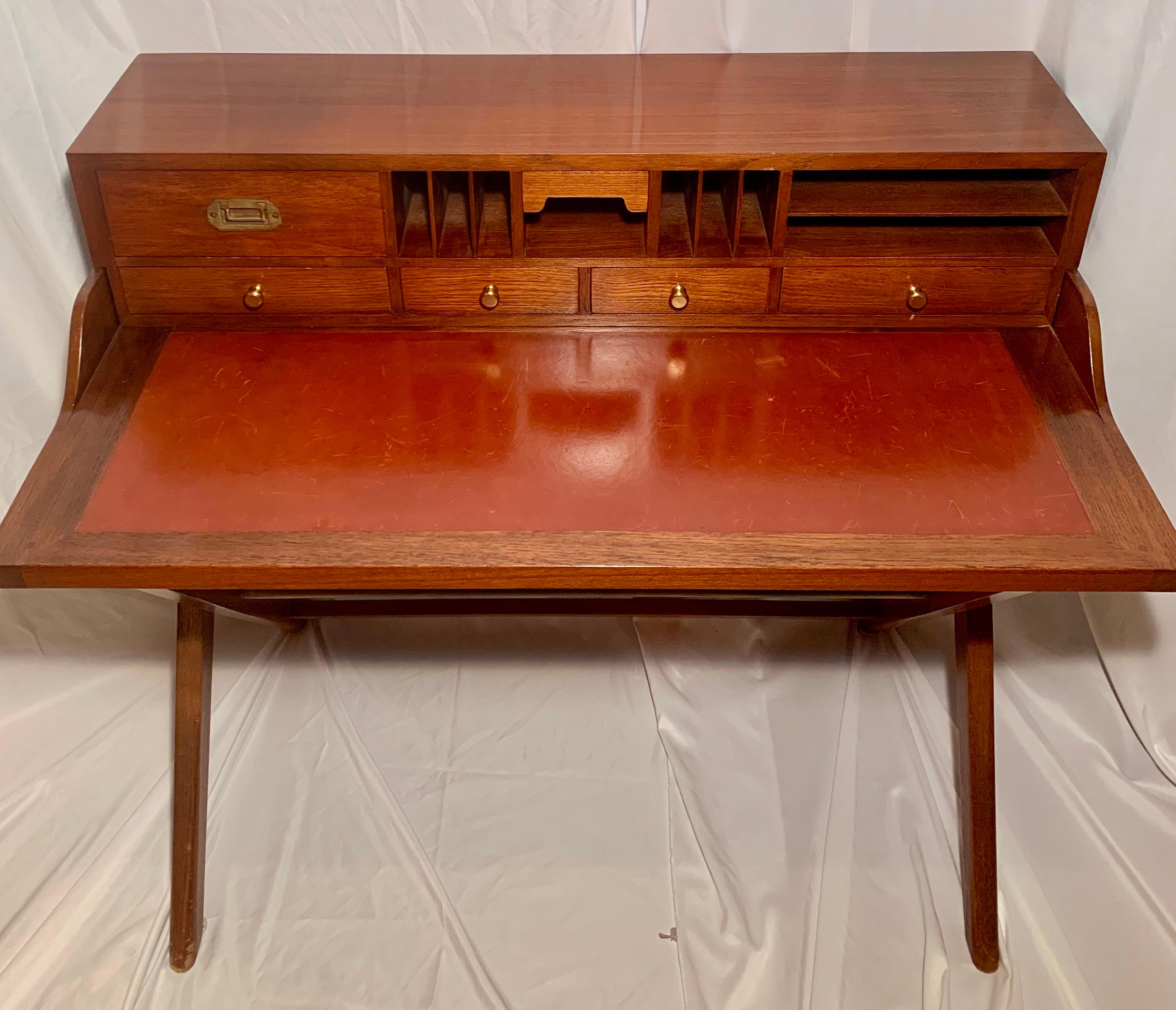 Handsome campaign desk of recent vintage with fitted drawers.

 