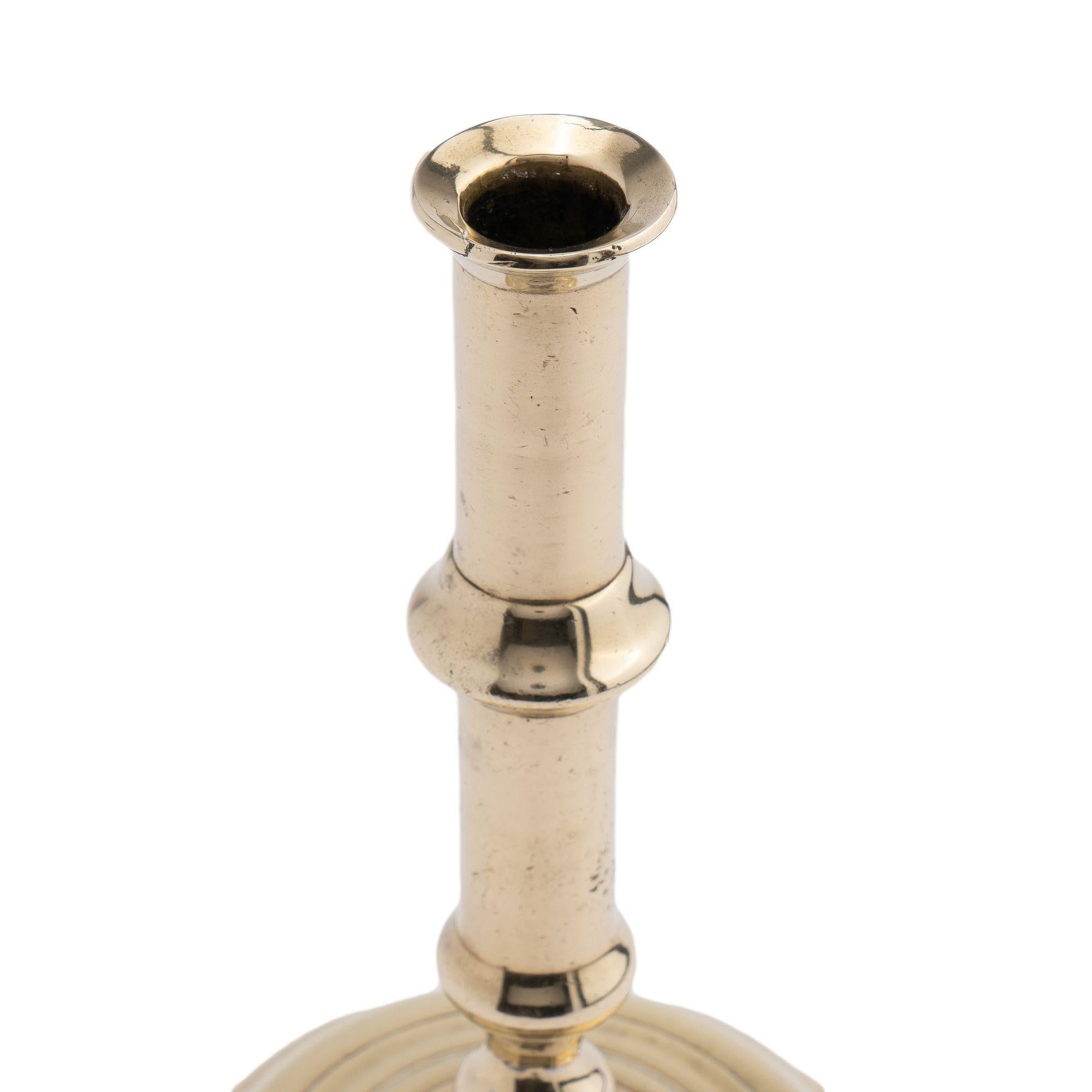 British English canon barrel brass candlestick on domed base, 1720-40 For Sale