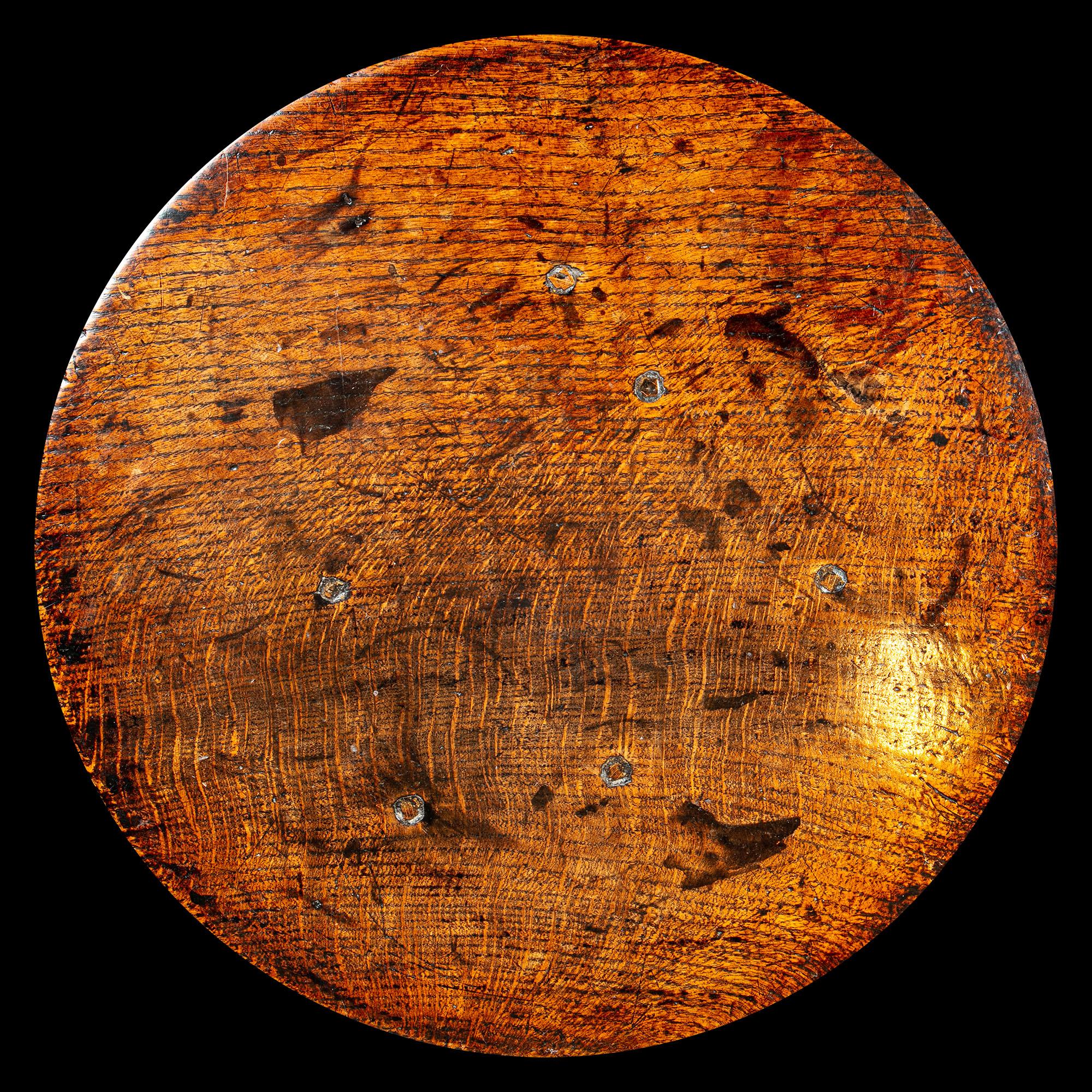 A late 17th century cricket table constructed in oak. A table of great character with a very attractive warm patina. The top has been removed and put back at some stage to prevent movement 

Size: 23.5 inches (60cm) high, 21 inches (53.5cm)