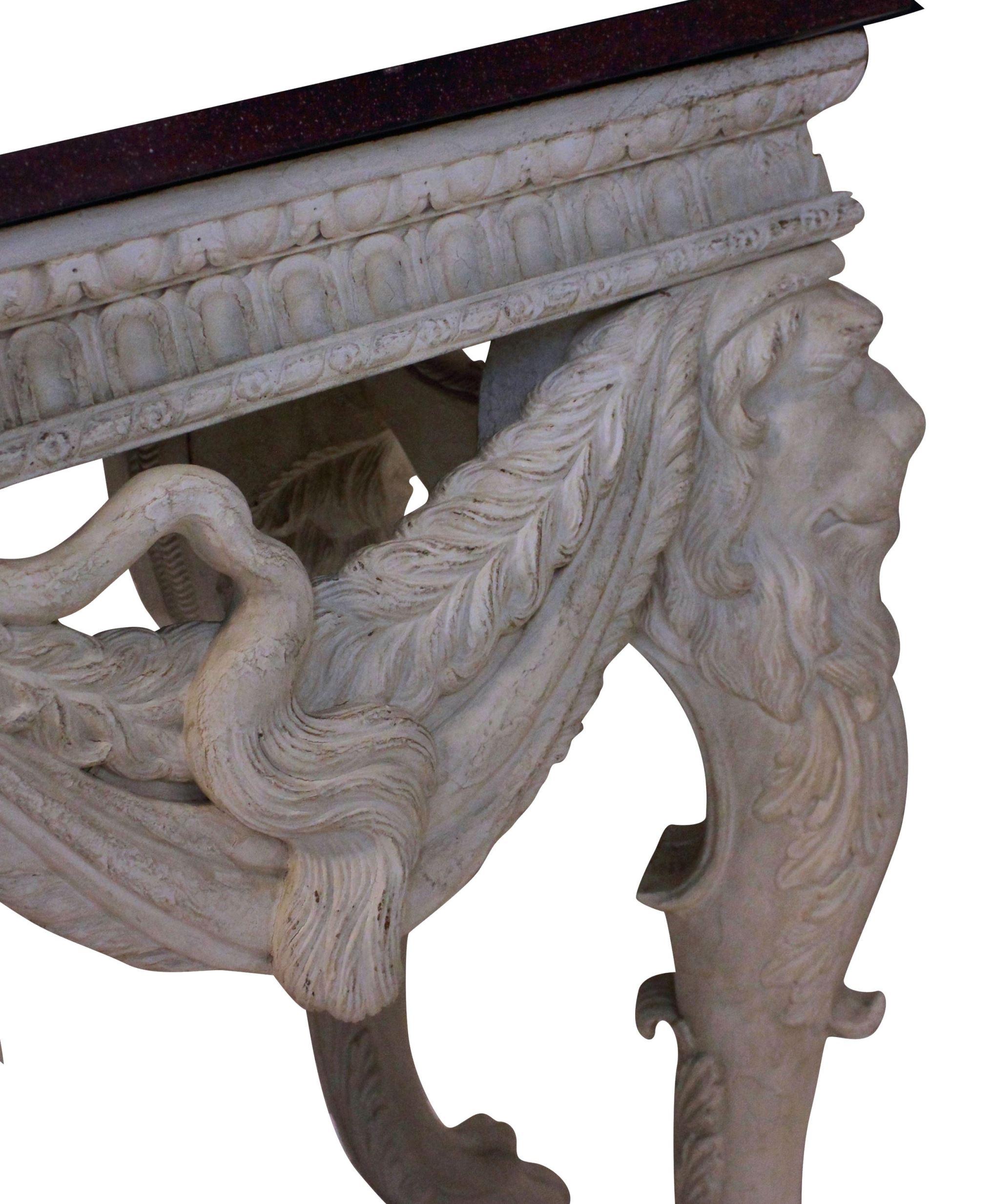 Early 20th Century English Carved and Painted Mahogany Console Table with a Solid Porphyry Top