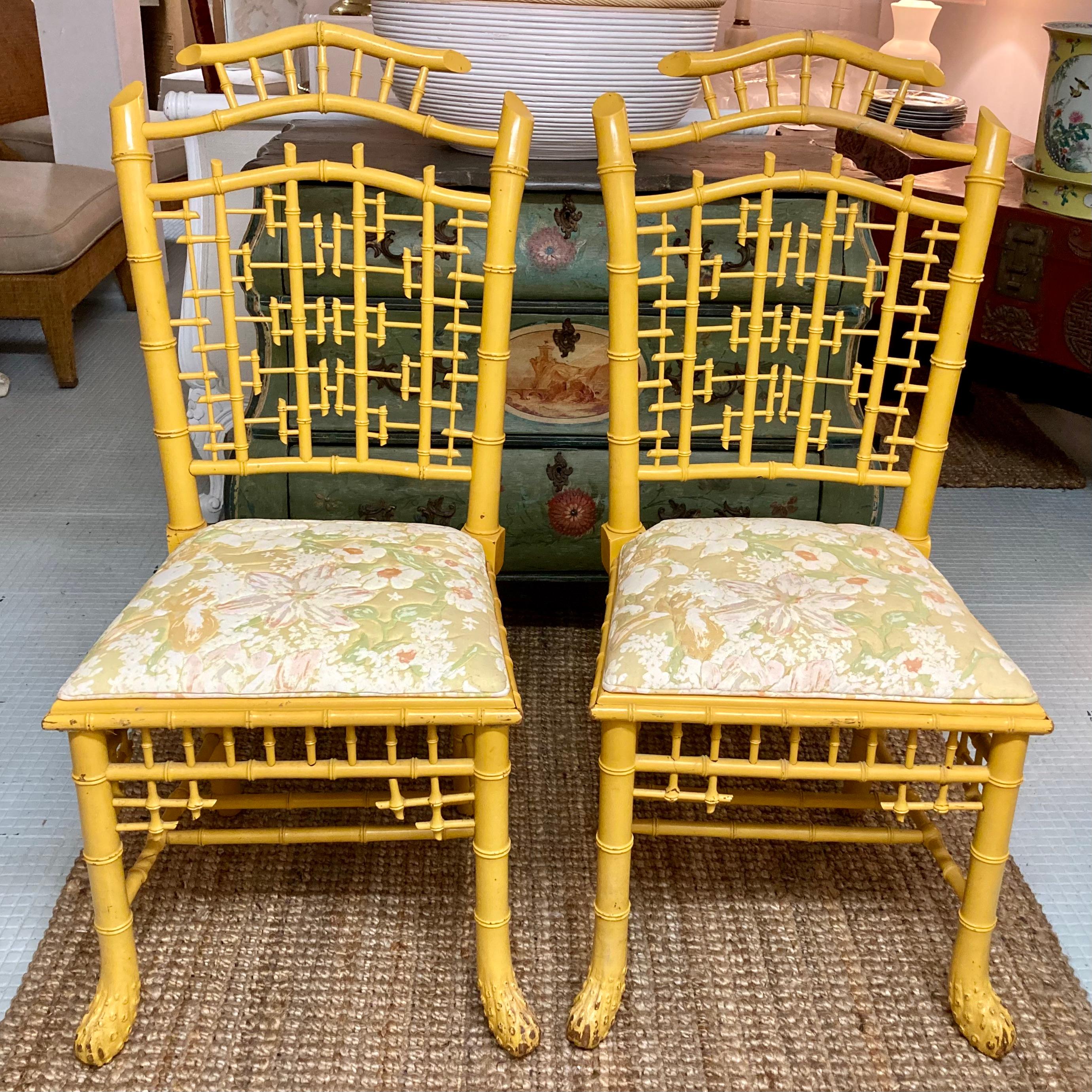 Beautiful pair of English carved faux bamboo Chinoiserie side chairs in yellow finish. These chairs are the style and age of the Brighton Pavilion these are crafted in England. Fun fact, the chairs are from the Estate of Kirk Douglas.