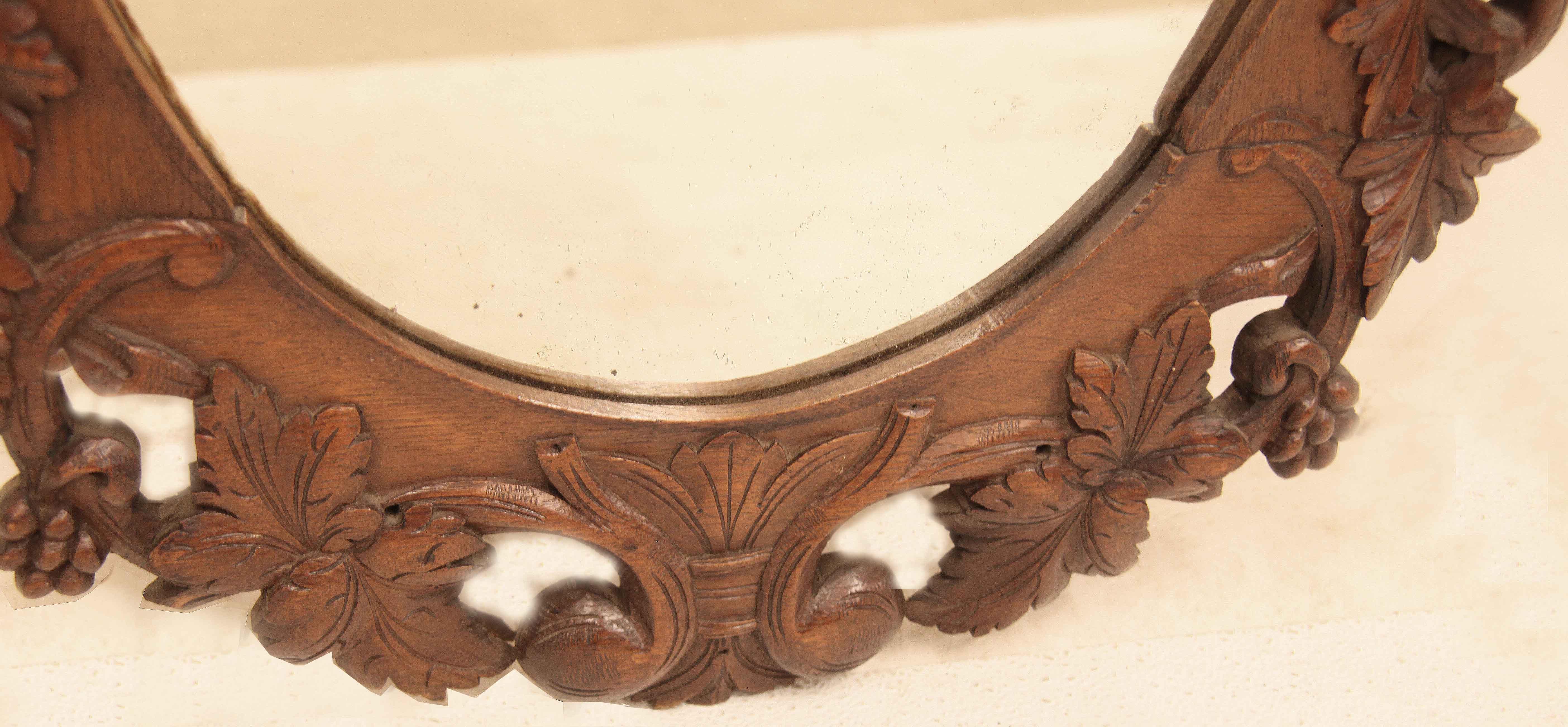 Late 19th Century English Carved Oak Oval Mirror For Sale
