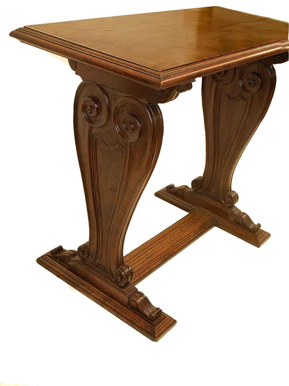English walnut center table, this two sided table has a thick top with beautiful grain and multi shaped molding; the lyre shaped supports have molded edges, arabesques, volutes, and other architectural features on the outside and inside; the base