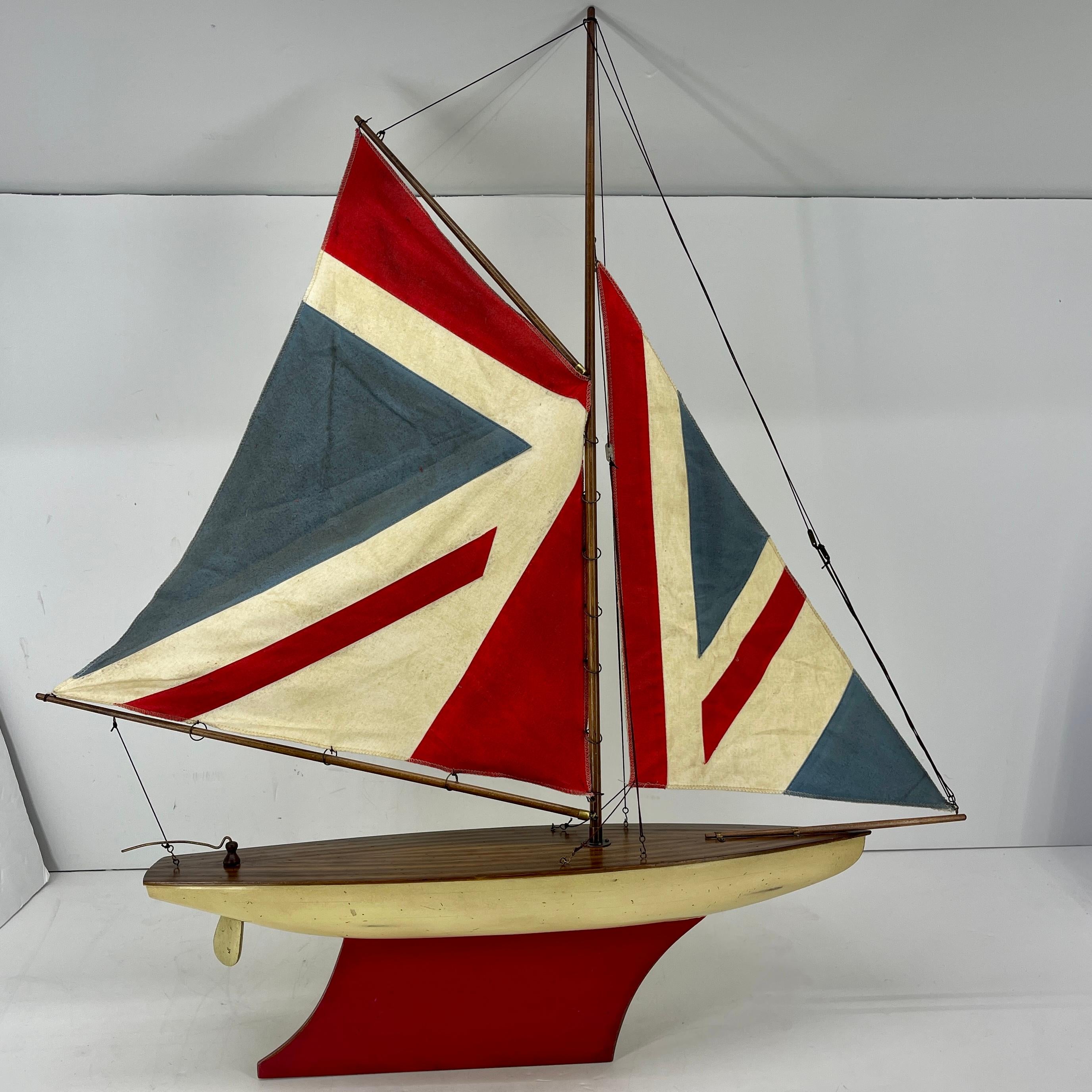 Hand-Crafted English Carved Wood Sailboat Model with Parquetry Deck and Union Jack Sailcloth