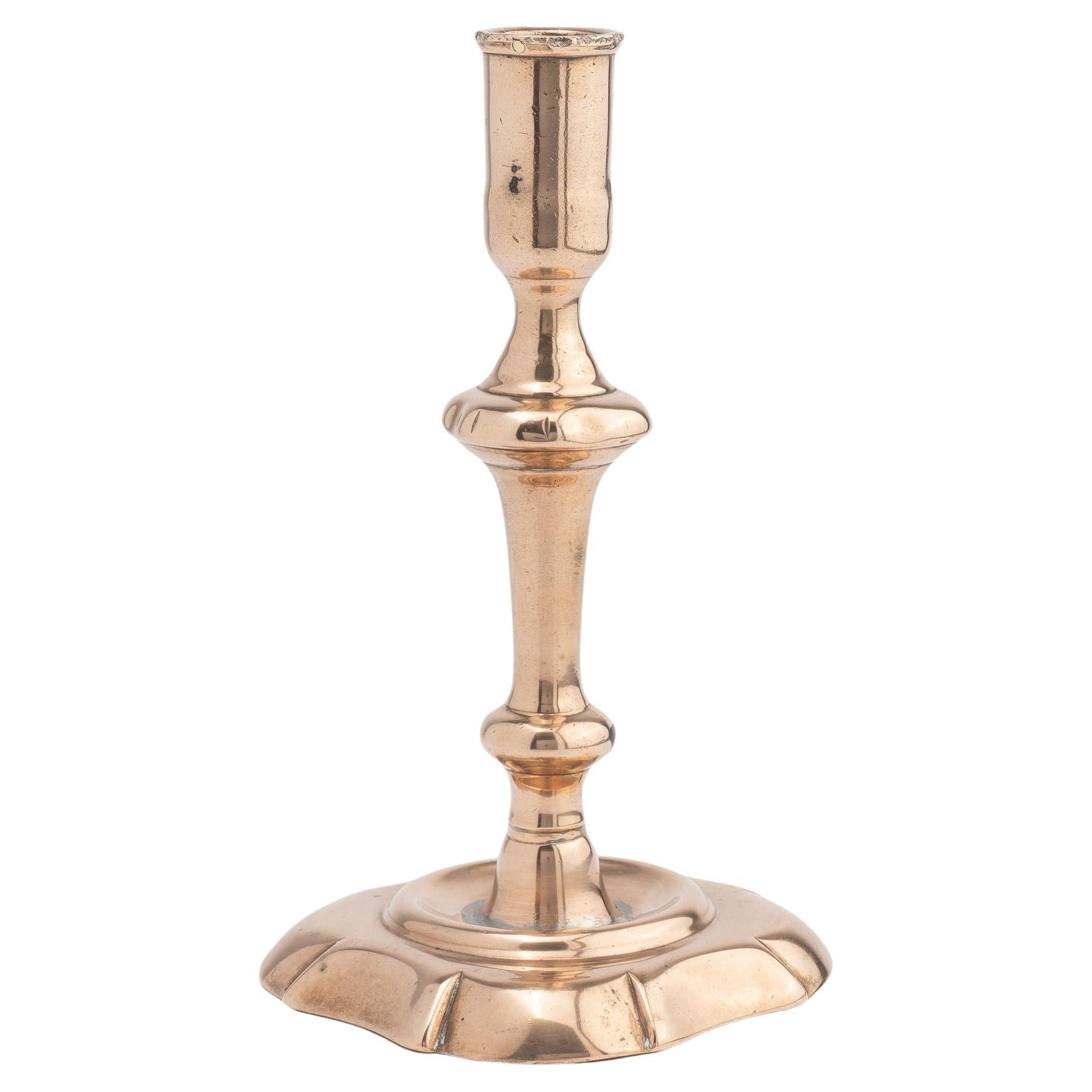 English cast bell metal Queen Anne baluster shaft candlestick, 1750-60 For Sale